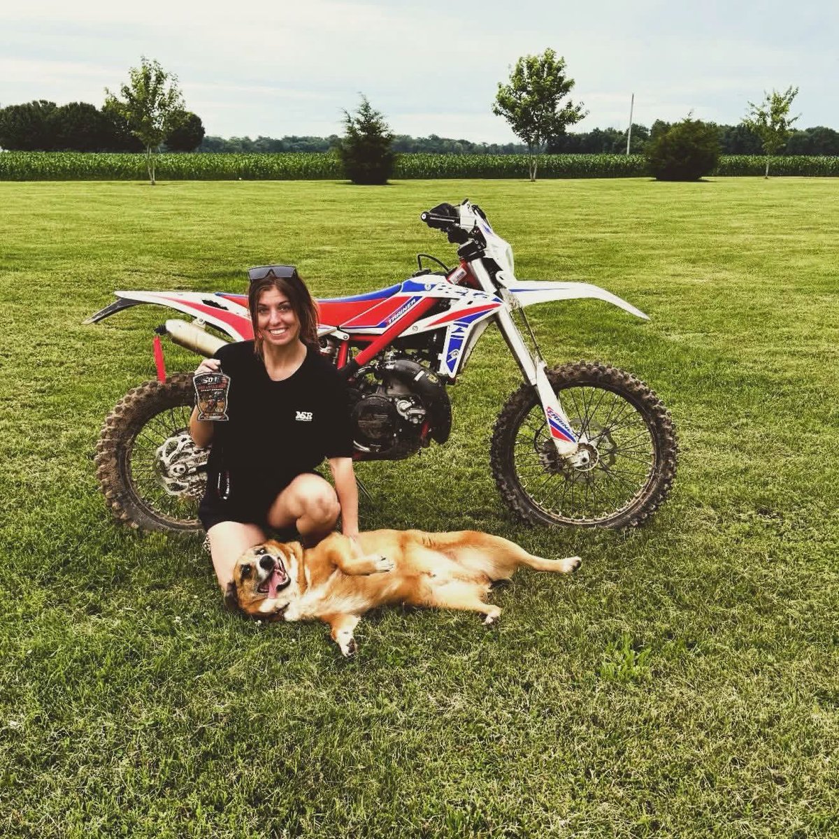 OleviaYerton's tweet photo. Just a girl who loves dirt bikes and her dog. https://t.co/WxfWUWAfMM