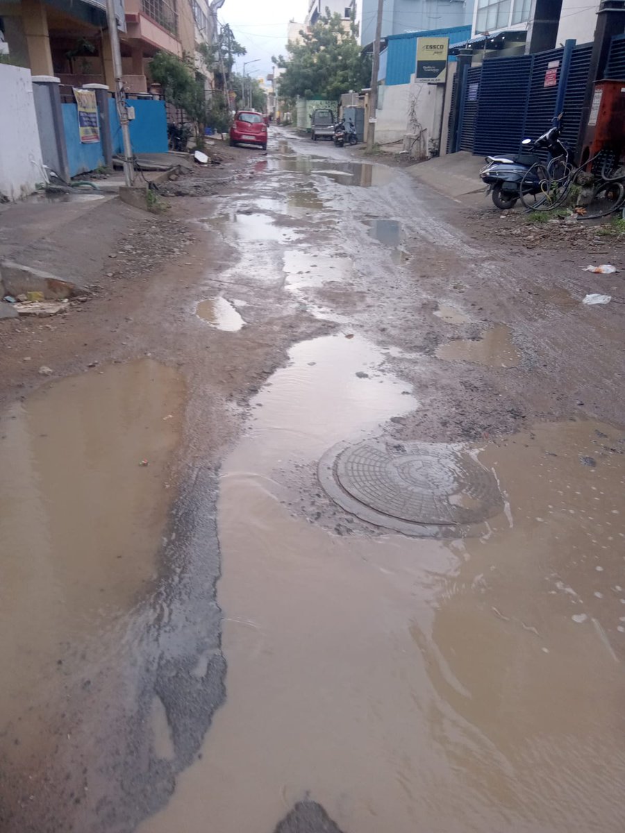 abhishekvpaul's tweet photo. @chennaicorp Photo op around generic planning sheet, shot outdoor, wearing helmets to show they're serious, etc. Meanwhile no response to complaints raised on work dragging on for months and this is the condition after one evening's rain at Kottivakam/Palavakkam https://t.co/BIDjIBOQac