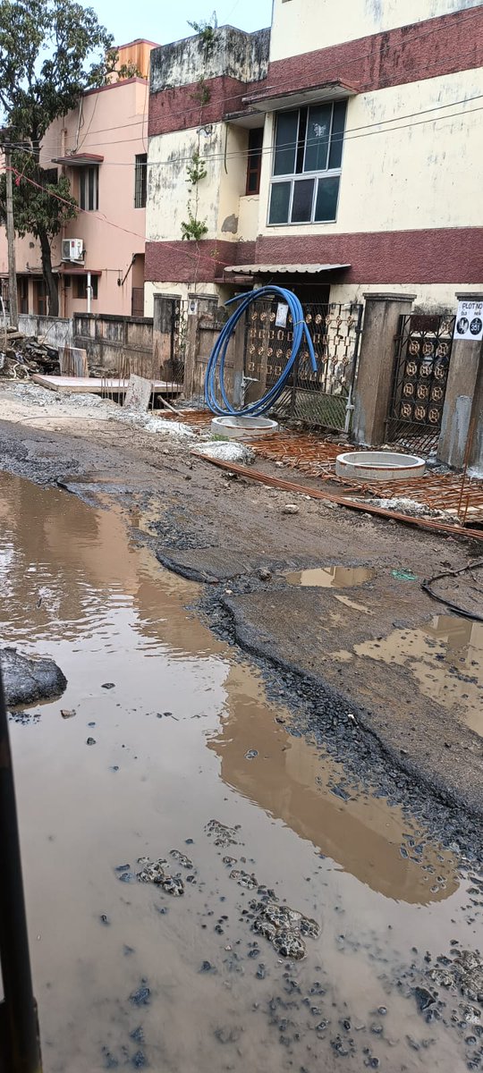 abhishekvpaul's tweet photo. @chennaicorp Photo op around generic planning sheet, shot outdoor, wearing helmets to show they're serious, etc. Meanwhile no response to complaints raised on work dragging on for months and this is the condition after one evening's rain at Kottivakam/Palavakkam https://t.co/BIDjIBOQac