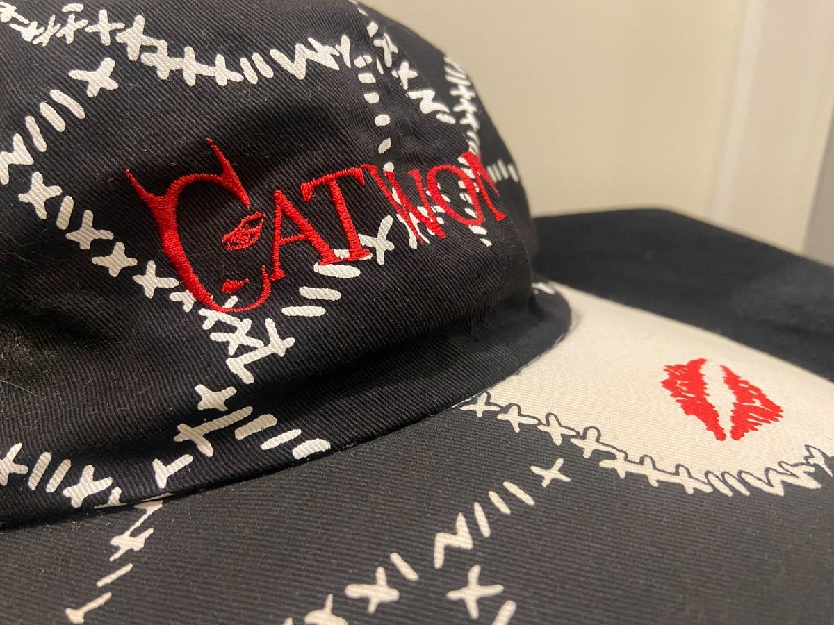 BatmanAnthology's tweet photo. Photos of a Batman Returns Catwoman Hat, which features the iconic stitches on her cat suit, the alternate character logo, and a kiss mark on the brim. This is such an amazing hat honestly, I kinda need it. https://t.co/Z3fMA34NPQ