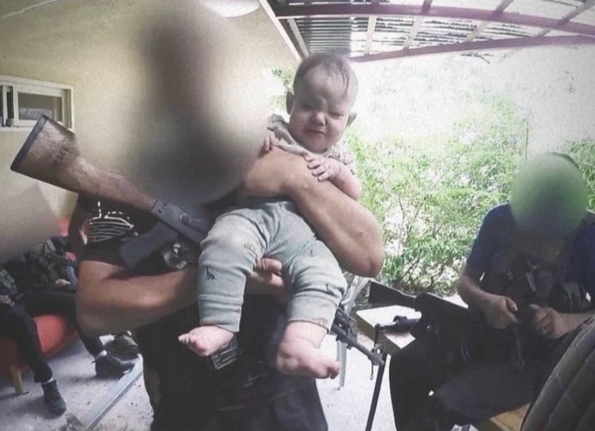 heart_ISR's tweet photo. On October 7, Hamas brutally murdered 33-year-old mother Adi Kaplon right in front of her helpless child.

Immediately afterwards, they took a photo with her child while Adi's lifeless body lay on the floor inside the house.

If anyone asks, this is the reason why Israel is at war.