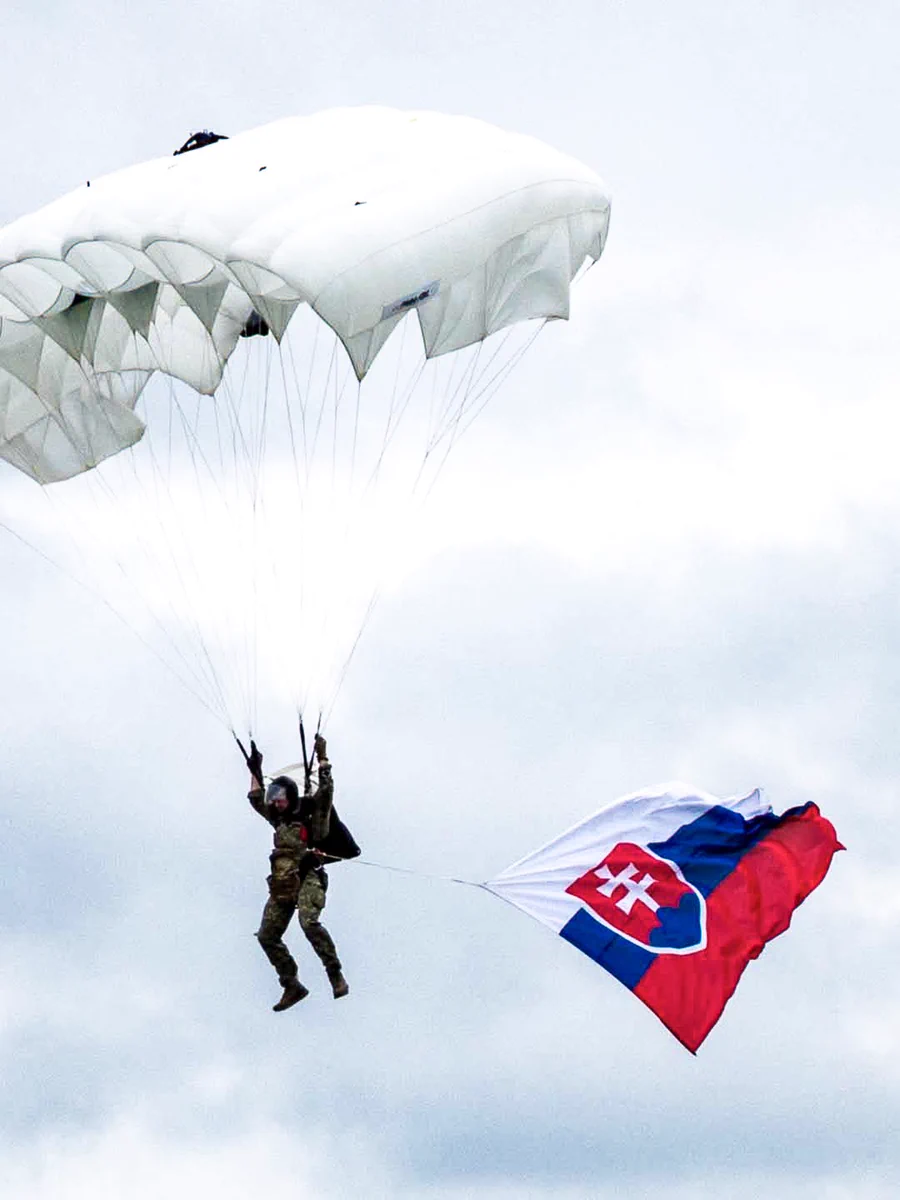 A soldier parachuting with a Slovak flag. Photo by Armed Forces of the Slovak Republic.