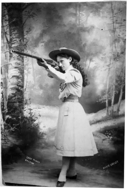 anishmoonka's tweet photo. Annie Moses was fifteen and five foot tall, shooting game to pay off the mortgage on her mother's house. A travelling marksman had bet 100 dollars he could outshoot anyone in Cincinnati, and a hotel owner entered her against him.

Frank Butler took 25 shots and missed one. Annie Moses took 25 and missed none.

She had learned to shoot as a child in Darke County, Ohio, hunting game and selling it to a shopkeeper after her father died. That trade was the family income.

Butler lost the match and the bet on Thanksgiving Day 1875, then started courting her. They married the following August and stayed married for fifty years.

She took the stage name Oakley in the early 1880s, joined Buffalo Bill's Wild West in 1885, and stayed with it for sixteen seasons. She earned more than anyone in the company except Cody himself.

Audiences watched her split a playing card edge-on at thirty paces and shoot a cigar out of her husband's hand. Her act was filmed in 1894 for one of Thomas Edison's early moving picture machines.

The tall tales piled up around her, including a novel that had her fighting off wolves and stopping train robberies. None of it happened.

What she did do offstage is better documented and less famous. She ran free shooting classes for women at hotels in New Hampshire through the summer and in North Carolina through the winter, year after year, and took no fee for any of it.

Her reason was plain enough. She wanted women able to protect their own homes, and by the end she is thought to have taught more than 15,000 of them.

https://t.co/qDjGuCZQJW