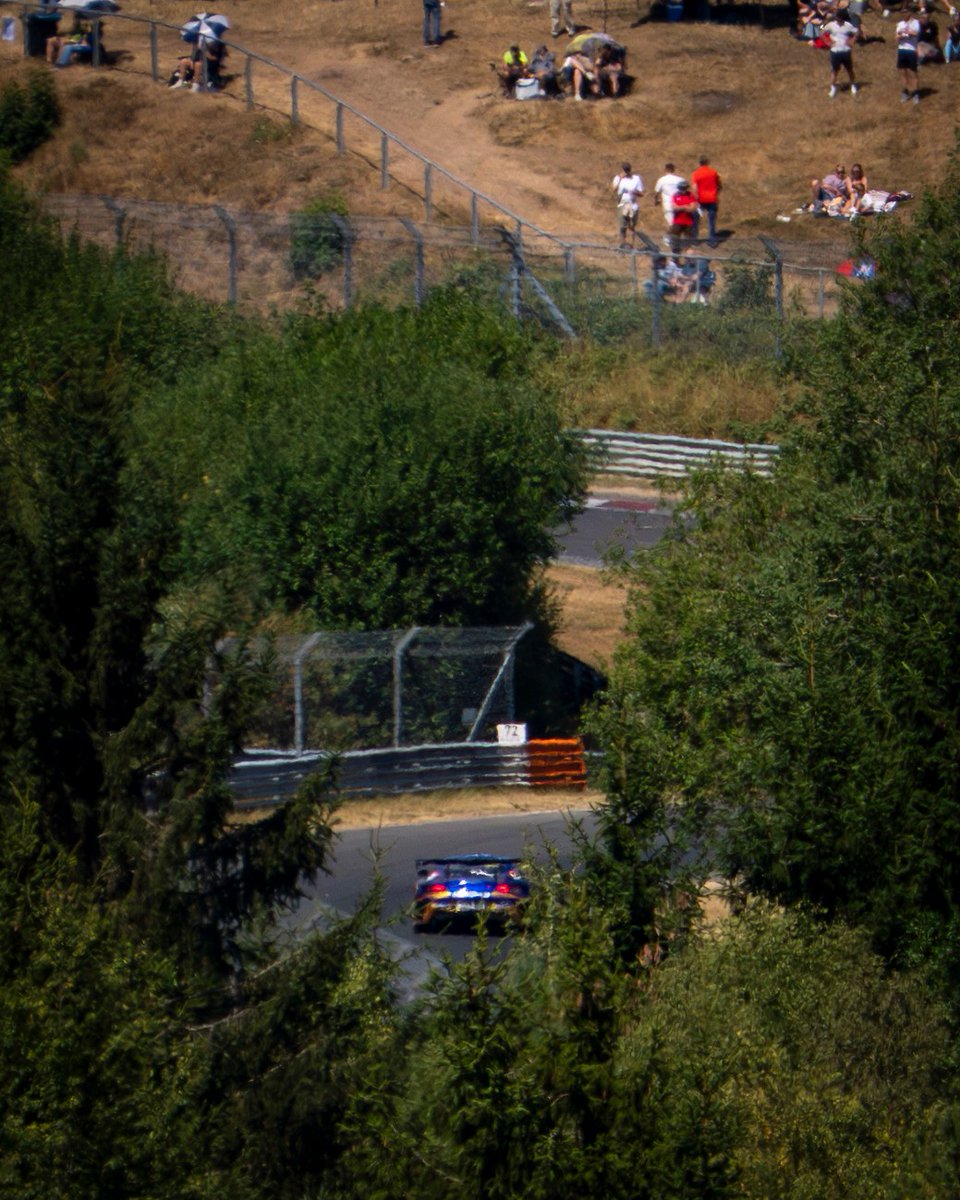 GretchenRujb's tweet photo. The Green Hell in all its glory. Amid dense forests and thousands of fans, the race car almost disappears into the landscape. This setting is what makes the Nordschleife unique. Nürburgring https://t.co/1G0GOm0m9s