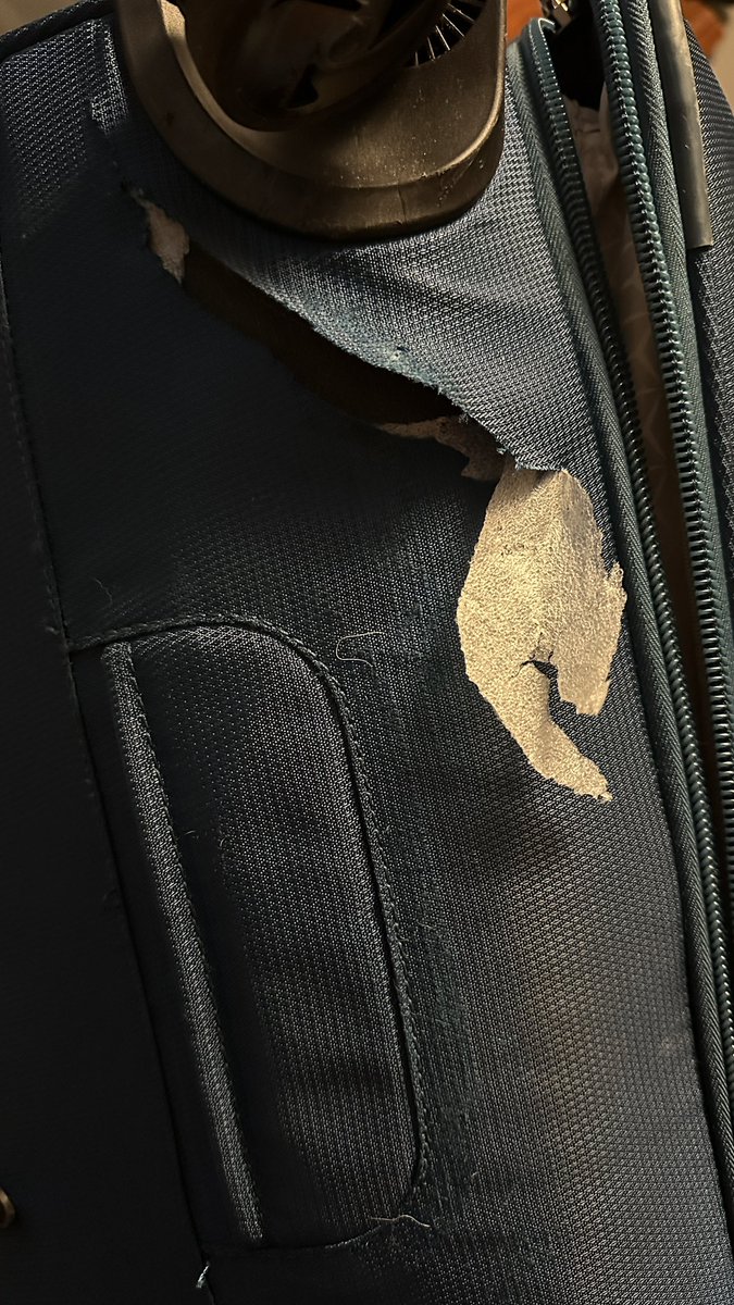 aaronsagers's tweet photo. Someone in Delta baggage handling woke up and chose violence. Between the gnarled zipper, slashed bag, and missing wheel, my bag will be a pirate this Halloween, complete with hook, eyepatch and peg leg. 
What’s the most extreme baggage damage have you experienced? #travel https://t.co/aYy54y0E7z