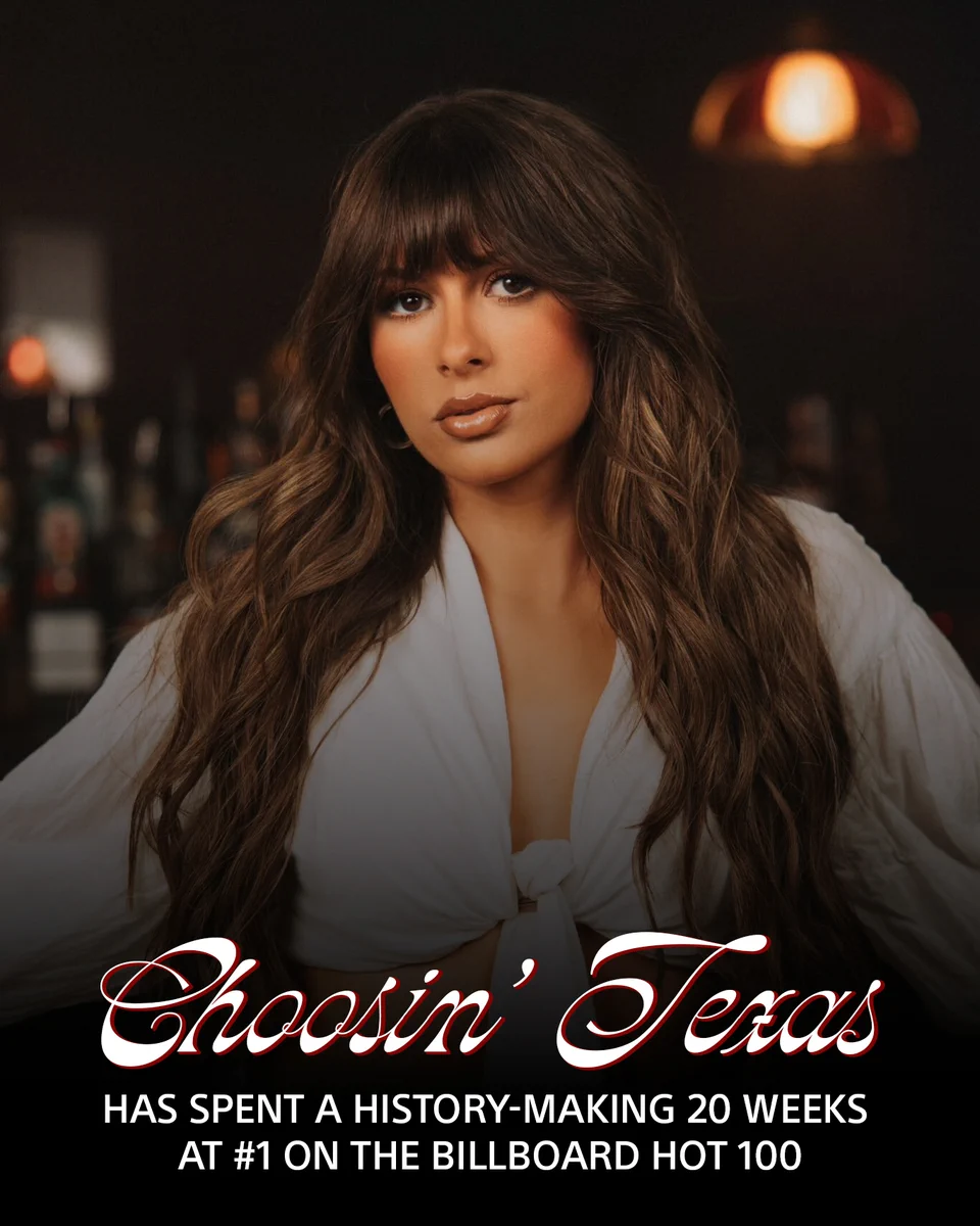 This image features Ella Langley with long brown hair and a white shirt on in a dimly lit setting. Text on the image reads, "Choosin’ Texas has spent a history-making 20 weeks at #1 on the Billboard Hot 100."