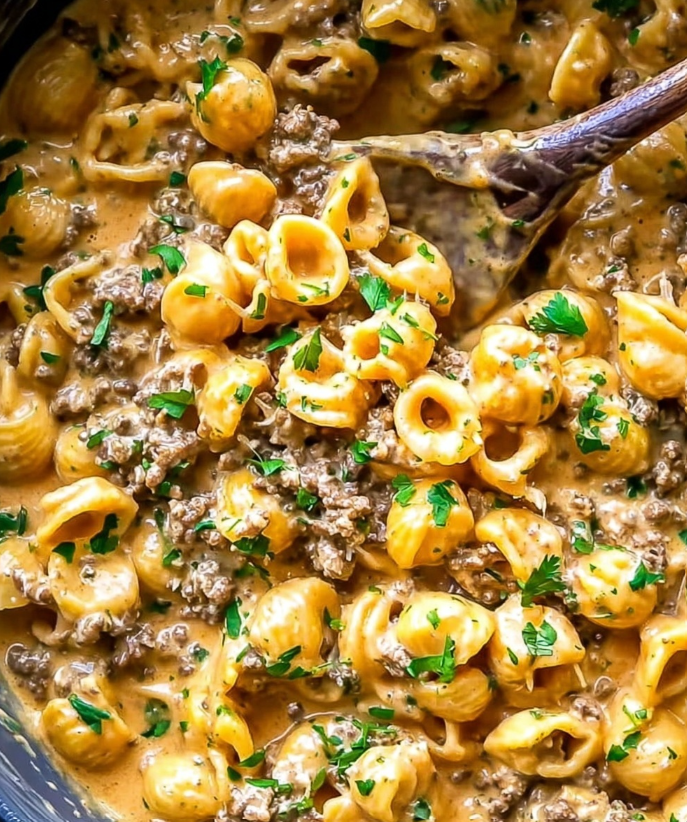 summer_food's tweet photo. Creamy Cheddar Beef Pasta with Fresh Zucchini 🍝🧀

🛒 Ingredients

2 tablespoons extra virgin olive oil

1 pound lean ground beefBeef

1 medium yellow onion, chopped

Kosher salt and black pepper, to taste

1 teaspoon chili powder

1 teaspoon paprika

1 teaspoon garlic powder

1 pound short cut pasta (such as shells, rotini, or penne)

1 zucchini, grated (about 1 cup)

2 cups low-sodium beef broth

1½ cups milk (any type you normally use)

1½ to 2 cups shredded cheddar cheese

1 tablespoon ketchup

Fresh parsley, chopped, for serving

👩‍🍳 Step-by-Step Instructions

Start by heating the olive oil in a large pot or deep skillet over medium-high heat. Add the chopped onion and ground beef, seasoning lightly with salt and black pepper. Cook for about 10 minutes, breaking the beef apart with a spoon as it browns. The onion should become soft and fragrant, and the beef should be fully cooked and nicely browned.Beef

Once the beef is cooked, stir in the chili powder, paprika, and garlic powder. Cook for another minute to allow the spices to bloom and coat the meat evenly, releasing their aroma and deepening the flavor.

Add the dry pasta directly to the pot along with the grated zucchini. Toss everything together so the pasta is well coated with the seasoned beef mixture. Pour in the beef broth and milk, then add the ketchup. Stir well to combine and season lightly with additional salt if needed.

Bring the mixture to a gentle boil over medium-high heat. Once boiling, reduce the heat slightly and let it simmer for 5 to 8 minutes, stirring often to prevent sticking. As the pasta cooks, it will absorb the liquid and release starch, helping to naturally thicken the sauce. The zucchini will soften and blend into the mixture, making the sauce extra creamy.

When the pasta is just al dente and most of the liquid has been absorbed, reduce the heat to low. Stir in the shredded cheddar cheese, adding it gradually and stirring constantly until fully melted and smooth. Continue cooking for another few minutes until the sauce becomes rich, creamy, and coats the pasta beautifully.Grains & Pasta

🍽️ Serving Suggestions
Divide the creamy cheddar beef pasta among serving bowls and finish with a generous sprinkle of fresh parsley for color and freshness. Serve immediately while hot and melty. This dish pairs well with a simple green salad or steamed vegetables for a complete meal.