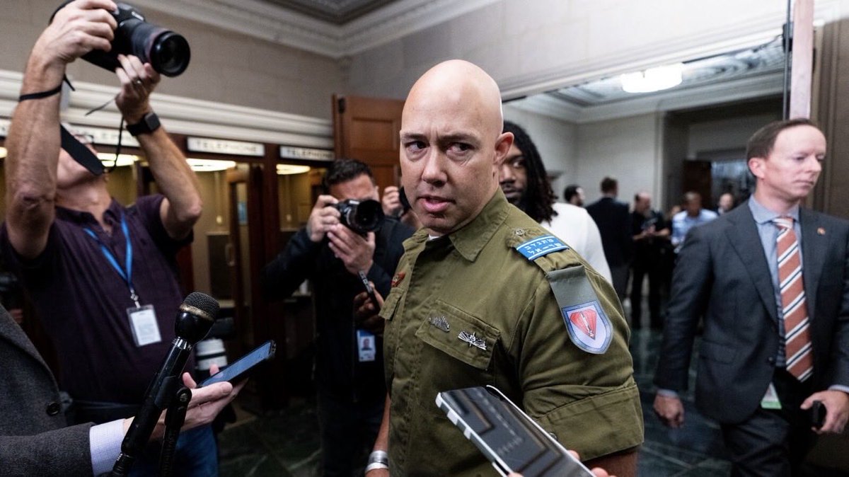 BraddrofliT's tweet photo. Brian Mast is a sitting Republican member of Congress representing Florida’s 21st District.

The U.S. has provided Israel billions in military aid, and this U.S. congressman showed up to a caucus meeting on Capitol Hill wearing an Israeli military uniform.

Imagine a member of Congress walking into the Capitol wearing the military uniform of ANY foreign nation.

Call it what you want. I call it treason
