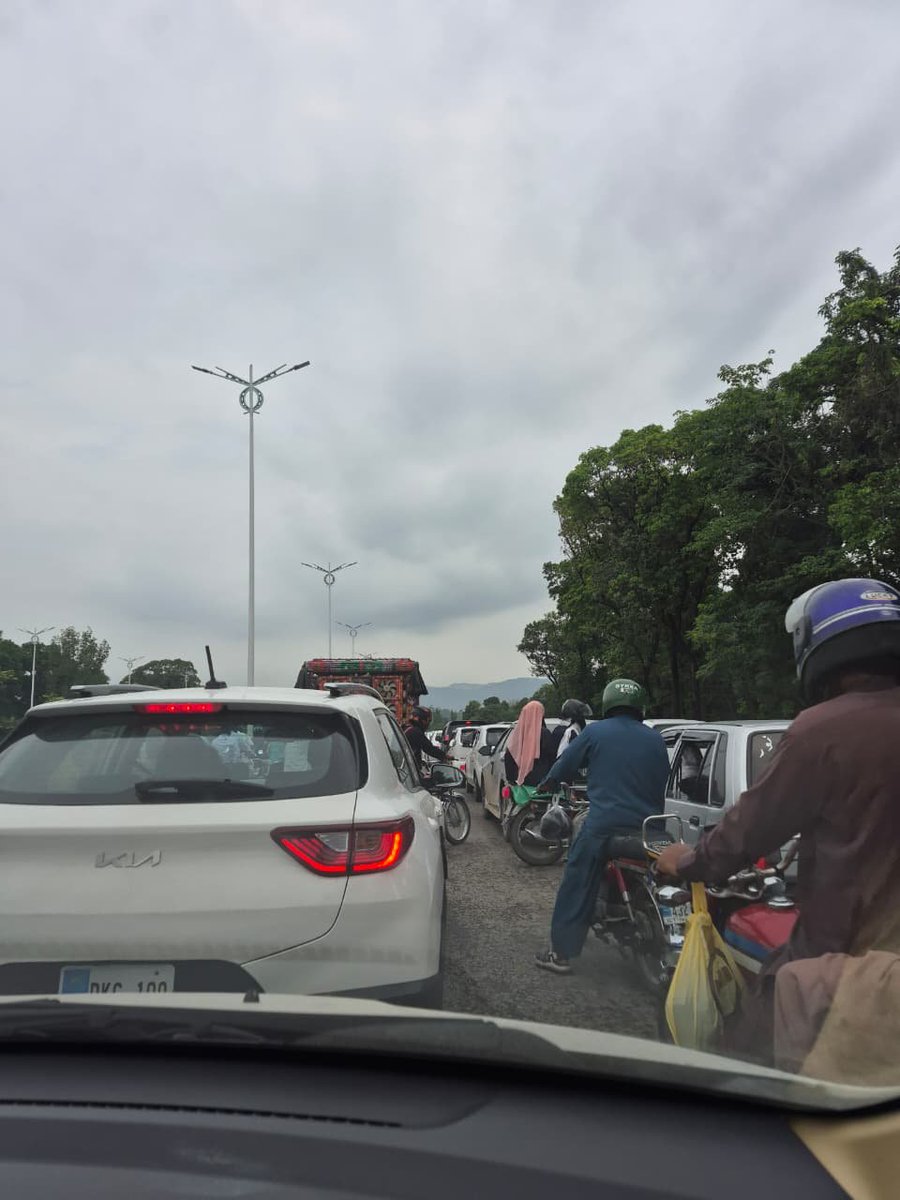 rubabhussain86's tweet photo. After 7 months of painful driving on Park Road due to underpass construction (which was never required), one link road has opened. The situation hasn’t improved—just fewer potholes! My car needs new tires and bumper paint from motorbike scratches. 
#Islamabad https://t.co/4oqs0qKoZr