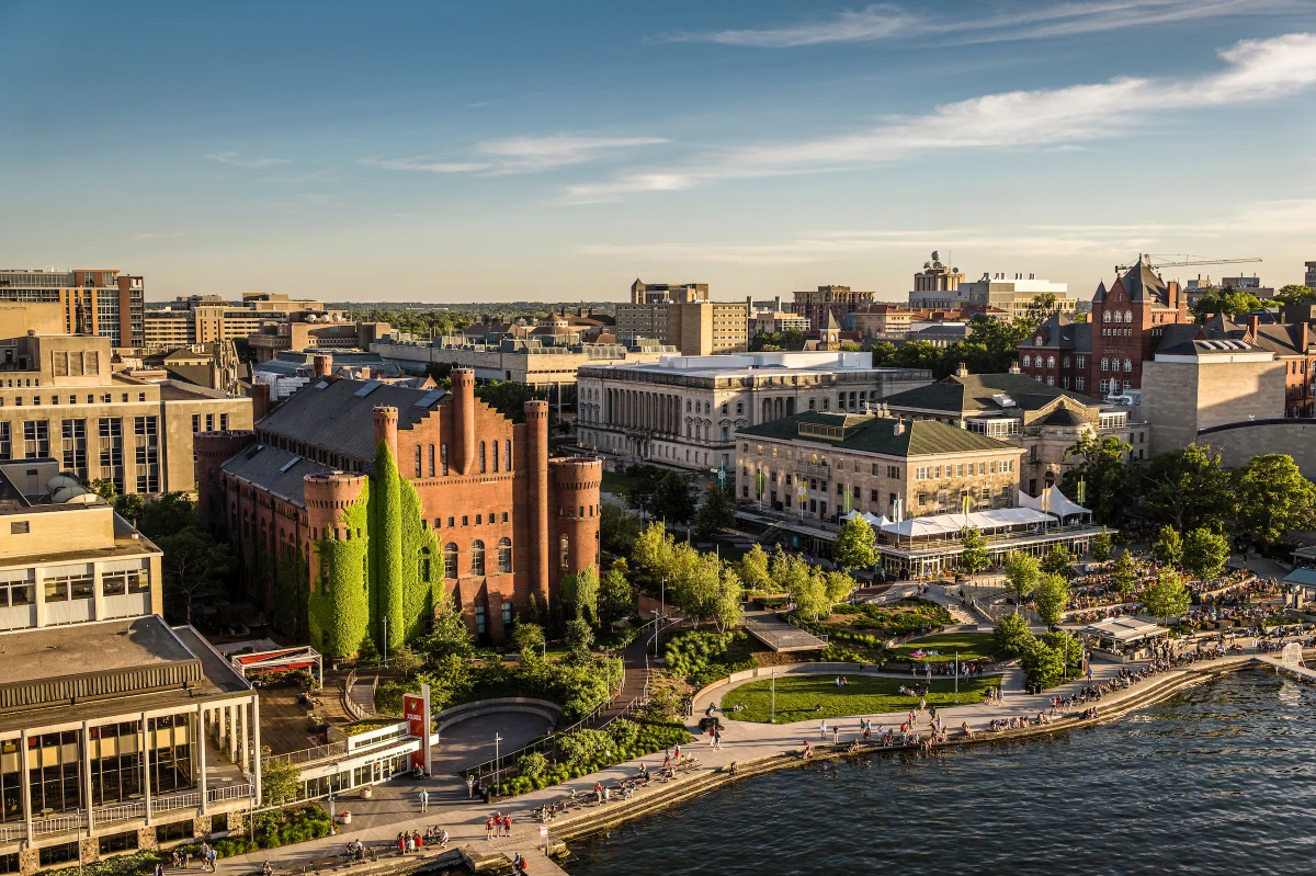 Aerial view of the University of Wisconsin–Madison campus featuring the ivy-covered brick Red Gym and Memorial Union Terrace along the shores of Lake Mendota.