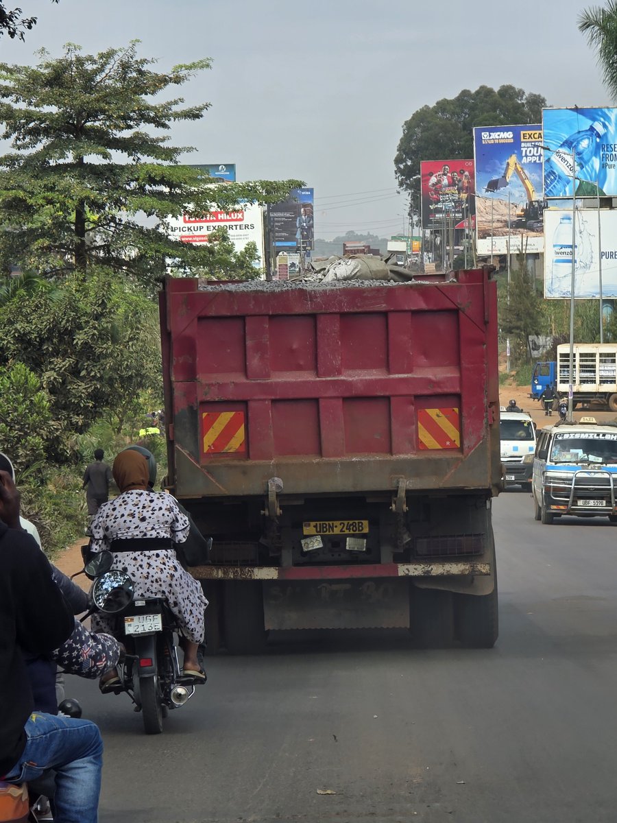OtaiPeter's tweet photo. You have a sino trucks carring aggregade stones uncovered moving at  high speed on a highway. Shouldn't we have this covered @PoliceUg @MoWT_Uganda @HonByamukama . This is risky those stones can hit a car causing an accident.  Must we just watch. https://t.co/XHOOjtfiBO