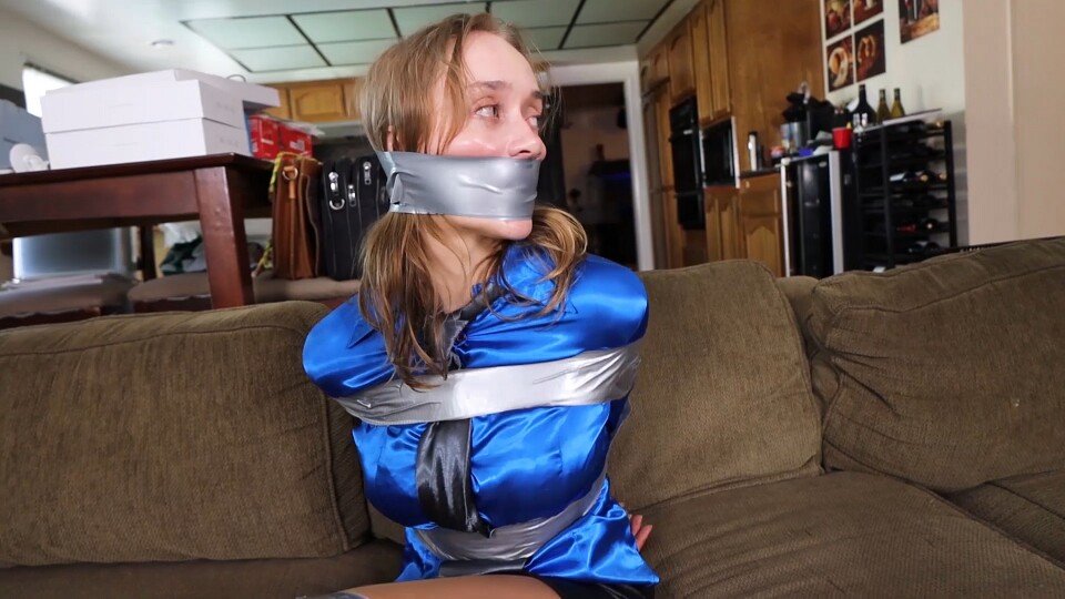 blanche_nina's tweet photo. TAPE GAG: WRAPPED OR STRIPS?

Tape is now a very iconic gag, more modern than the cleave gag or the classic OTM gag. It started becoming popular around the 1960s through spy and action movies, and it is now arguably even more popular than any other type of gag in films. Of course, DID productions also use it a lot for the enjoyment of the audience.

However, a tape gag can be used in two very different ways: either with one or a few strips of tape applied over the damsel's mouth, or with tape wrapped around the damsel's head.

Personally, I definitely prefer the single or few strips of tape, but that's just a personal preference. Both forms have their advantages and disadvantages. Let's take a closer look at them:

SINGLE OR A FEW STRIPS OF TAPE

ADVANTAGES

- Very simple to apply, while still being effective. It can also enhance the humiliating style of the gag.
- It can sometimes show the shape of the lips, which can be very attractive.
- Easy to remove and put back if the captor, for some reason, needs to talk with the captive for a little while.
- Perfect for suddenly cutting off the damsel's speech.
- It keeps her face almost entirely intact.
- It keeps the girl's hairstyle intact.
- It looks more comfortable for the girl compared with the wrapped tape gag.

DISADVANTAGES

- Less effective than the wrapped tape gag. It is easier for the girl to remove.
- The tape has to stick very well, whereas a wrapped tape gag can work without needing to stick as strongly.

WRAPPED TAPE GAG

ADVANTAGES

- Extremely effective: the damsel definitely won't be able to pronounce a single word.
- Extremely secure. As long as the damsel is restrained, it is almost impossible for her to remove the gag herself.
- The damsel looks much more helpless with this style of gag.
- Because the gag is so effective and restrictive, it can create a more humiliating appearance.
- It matches very well with a mummified tape bondage style.

DISADVANTAGES

- It can really distort the damsel's face.
- It can completely ruin the girl's hairstyle.
- It can be tricky to remove, which can be a real problem when changing the gag or allowing the girl to talk for a little while.

How about you? What do you think? Do you prefer the single/few strips of tape or the wrapped tape gag style?

I do not own these pictures. All rights belong to @Hollyrope . Here are clear references for these videos:

1st picture: "Mina Salome, sexy redhead detective tightly taped up, tape pressing against her shiny magenta satin blouse, tightly tape gagged in a detective story" available on this link https://t.co/mfzLJ8pvES

2nd picture: "Mina the catburglar takes a lesson about hot to escape in case she ever gets tied and gagged" available on this link https://t.co/UI2uQRsVBy

3rd picture "Jade Rose as the Agent Silverstone: Trapped in the enemy's lair, tightly taped up to a chair and gagged without hope of escape!" Available on this link https://t.co/XUCUITlNHq

4th picture "Jade Rose needs to be tightly tied up and wraparound tape gagged to fake a robbery that will save her from being fired" available on this link https://t.co/IvyTFzQGo2