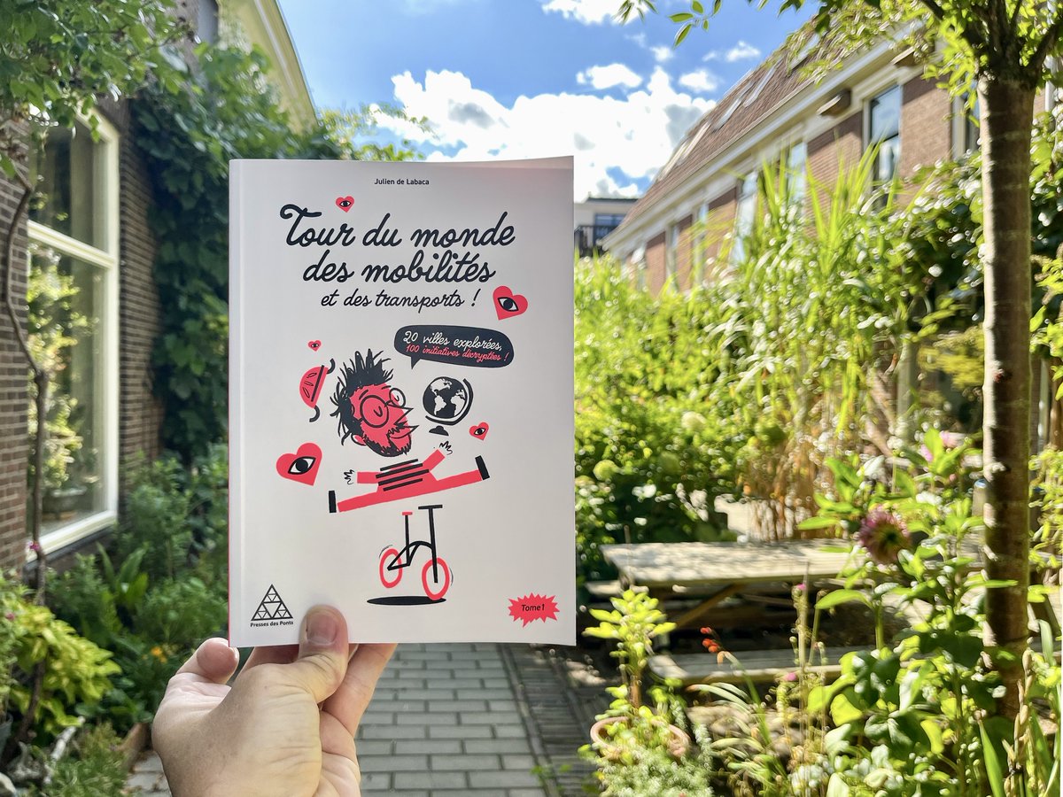 Photos of a book 'Tour du Monde des Mobilités et des Transports' which features words and photos about the city of Delft.