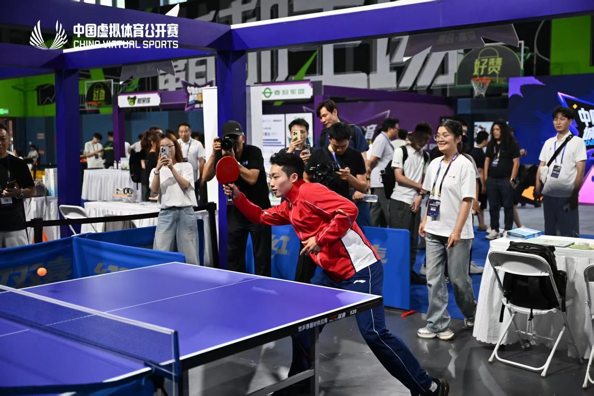 HefeiChina's tweet photo. An Olympic gold medalist, nervous? Yes! Wang Zongyuan took on virtual cycling and table tennis at China Virtual Sports Carnival in #Hefei. New challenges, real emotions — that's the beauty of sport. 🏅🎮💪 #VirtualSports #FutureOfSports #OlympicChampion https://t.co/6WPxWZA75f