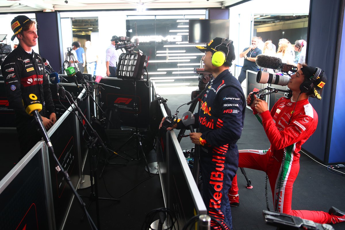 Formula2's tweet photo. It's never too late for a career change 😭🎥

Ollie and Ayumu tried their hand at media duties back in 2023, interviewing Théo in the pen 😅

#F2 #ItalianGP https://t.co/swhDtUVu5s