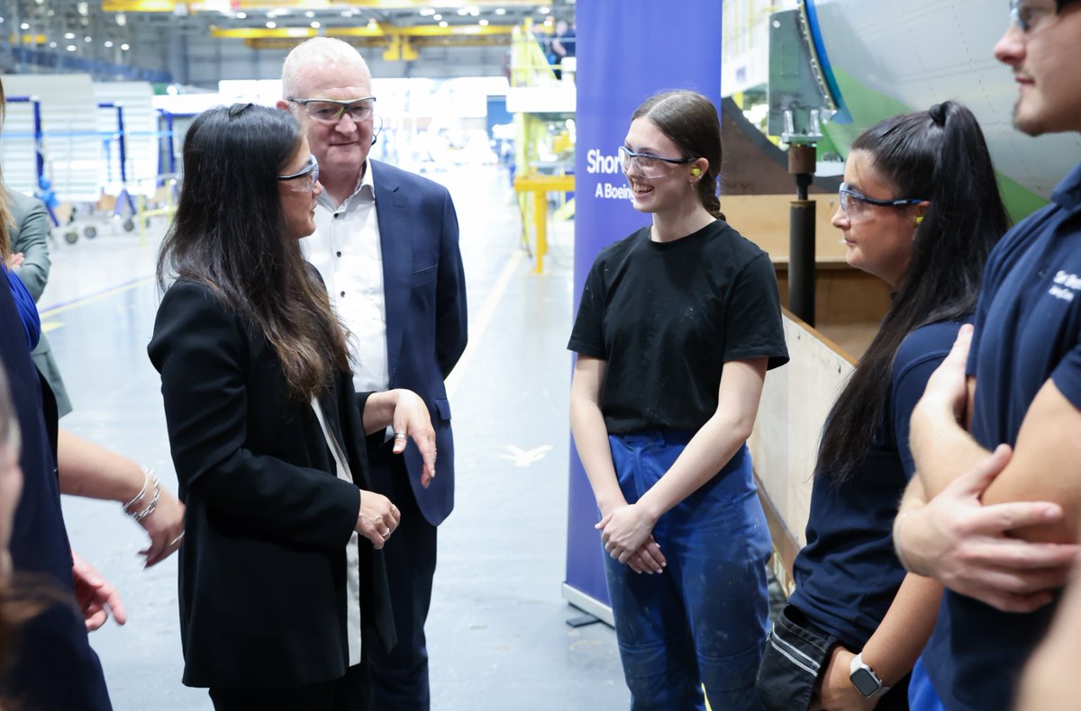 Minister for Northern Ireland Sarah Owen talking to apprentices at Short Brothers.