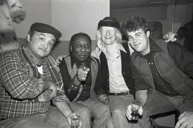 dan_aykroyd's tweet photo. New York City, 1977. John Belushi, Muddy Waters, Johnny Winter and me backstage at The Bottom Line. Four guys brought together by the blues.

We loved them and they embraced us. Johnny Winter frequently wore a Blues Brothers t-shirt on stage. 

Photo by Bob Gruen. https://t.co/Hcd1lKIg3O