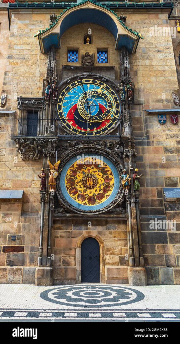 homogalactic's tweet photo. Installed in 1410, the Prague Astronomical Clock has stood over the Old Town Square for more than 600 years.

The Prague Astronomical Clock (known as the Prague Orloj) was indeed installed in 1410, making it the third-oldest astronomical clock in the world and the oldest one still operating.

Key Features of the Clock: The Astronomical Dial: Represents the positions of the Sun and Moon in the sky, showing various astronomical details. The Walk of the Apostles: Every hour from 9:00 AM to 11:00 PM, figures of the Twelve Apostles and moving mechanical statues—including a skeleton representing Death striking time—appear in the windows above the dial. The Calendar Dial: Added later in 1870, it features medallions.
The tragic legend of the clockmaker Hanuš who built it.

According to popular folklore, the genius behind the Prague Orloj was Master Hanuš (historically known as Jan Růže).

Once the clock was completed in 1410, it became the wonder of Europe. People traveled from far and wide to marvel at its complex dials, moving statues, and flawless mechanics.

The Prague City Councillors grew deeply proud of the masterpiece, but their pride quickly turned into paranoia and greed. They became terrified that Hanuš would build an even grander, more beautiful clock for another rival European city, stripping Prague of its unique glory.

To prevent this, the councillors plotted a horrific crime:
The Betrayal: A group of masked men broke into Hanuš’s workshop at night.
The Act: Acting on the council's orders, they blinded the master clockmaker with a piece of hot iron so he could never draw plans or build a clock again.
The Ultimate Revenge:
Driven mad by grief and betrayal, Hanuš knew exactly who was responsible. Weak and dying, he asked his loyal apprentice to guide him up into the clock tower one last time under the pretense of saying goodbye to his life's work.
The Sabotage: When they reached the heavy iron gears, Hanuš reached deep into the intricate mechanism and ripped out a vital component.
The Curse: The heavy machinery ground to a halt, and Hanuš collapsed and died on the spot.

Legend says that the clock cursed the city in return. It remained broken and completely silent for over 100 years because no other clockmaker in Europe possessed the genius required to understand Hanuš's design and repair it.

Historical Note: While this haunting legend has been told for centuries and was popularized by writer Alois Jirásek, historical records later revealed that the clock was actually built by Mikuláš of Kadaň and Jan Šindel. Hanuš was a real clockmaker, but he repaired and advanced the clock later in the 1490s.