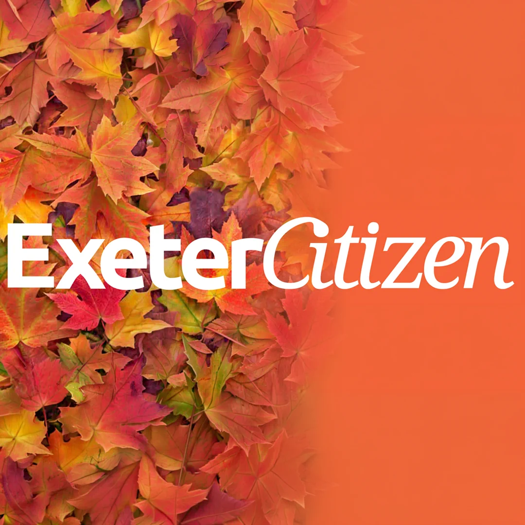 A square autumn-themed graphic featuring a dense cluster of red, orange, yellow, and green maple leaves fading into a bright orange background. Large white text across the center reads “ExeterCitizen.”