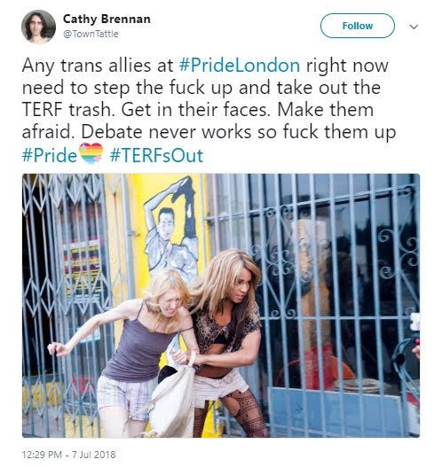 GirlGirl124525's tweet photo. Look at this picture. This is an adult man, dressed as a "woman" grabbing an actual woman on the street to do God's knows what. Read the caption. "Make them afraid." The goal of trans identified males is to make women afraid. It's working. TIMs should never be in women's spaces. https://t.co/gy0LrxLUJX