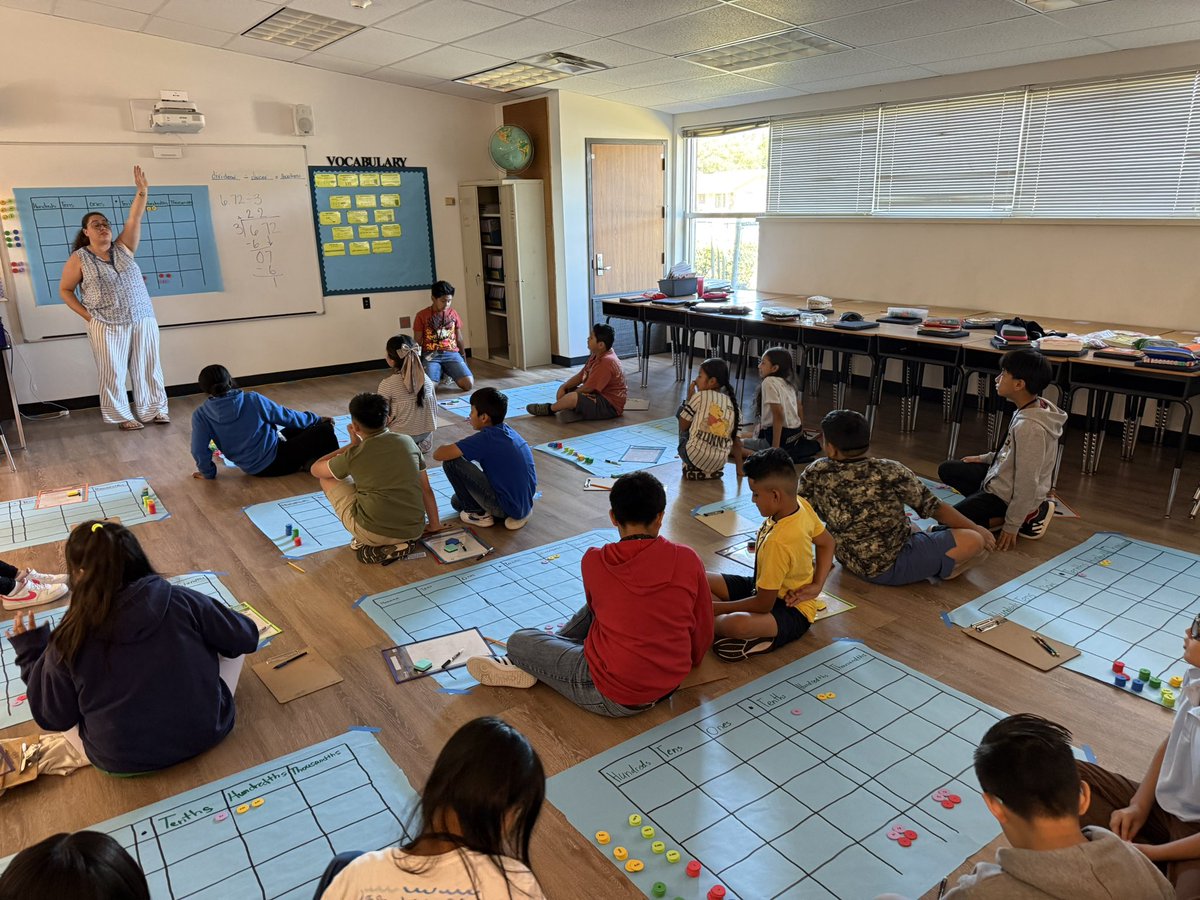 MathWithAudrey's tweet photo. 5th grade math is happening on a HUGE scale in Mrs. Hale’s class at OHE! She rearranged the entire room to give students space to model dividing with decimals and engage in the math hands-on. Love seeing teachers get creative to bring the math to life! @ohe_mustangs @kristinleeper9 @RISDmath #RISDDreamBig #RISDistheOne