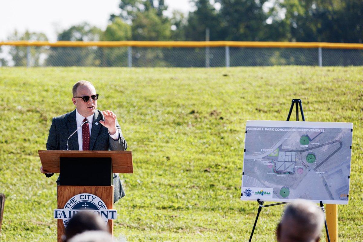 TravisBlosser's tweet photo. This neighborhood has waited long enough.

Today, Team Fairmont broke ground on the largest investment the City has made in Windmill Park in decades.

Windmill Park sits in the heart of Fairmont’s historic African American neighborhood. For generations, the investment made here did not reflect the importance of this park or the community surrounding it. And we have to be honest: that disinvestment did not happen in a vacuum.

Fairmont was not immune from a history in which African American neighborhoods were too often the last to receive public investment and the first expected to make do without it.

We cannot rewrite that history. But we can decide whether we continue it.

Over the last two years, we’ve made a deliberate choice not to.

This new concession stand is another major step… but it won’t be the last.

Every neighborhood matters. Every neighborhood deserves investment. And where you live in Fairmont should never determine whether your community is worth investing in.

We’re not simply turning dirt at Windmill Park. We’re turning a page.

💙 TEAM FAIRMONT