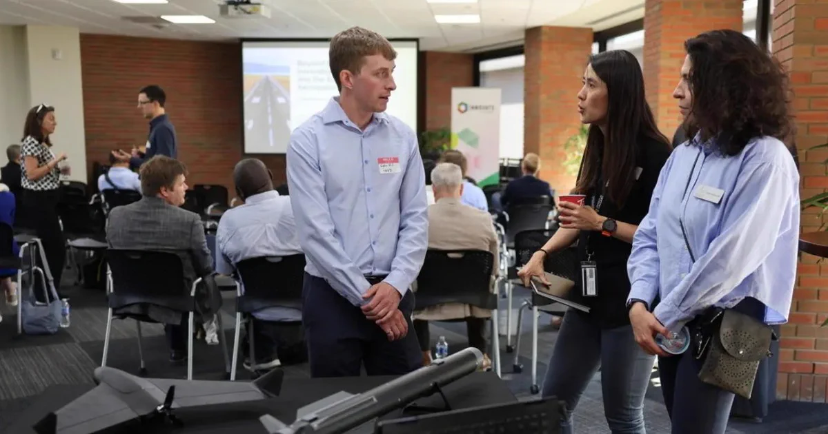 Colin Hill, co-founder and CTO of North Vector Dynamics and part of the first AAP cohort, showcases a drone his company makes.