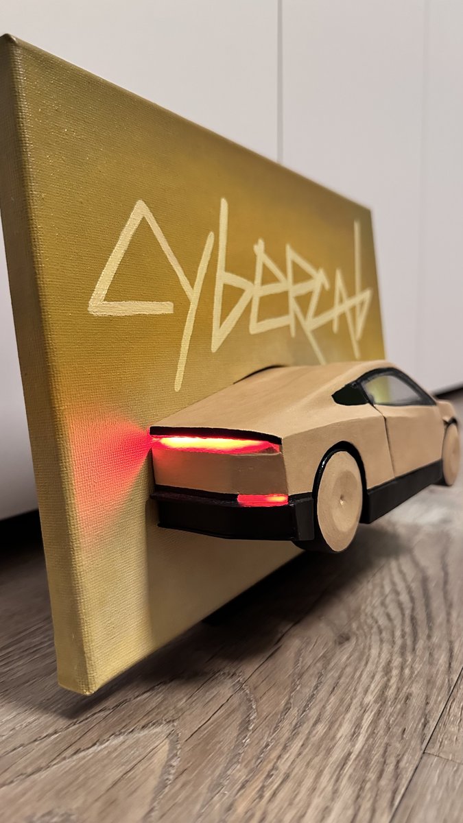 StarChopsticks's tweet photo. With the Cybercab joining the @robotaxi service tomorrow in Austin, I built a 3D model at 1:21 scale with working lights, combined with a painting of its iconic lettering https://t.co/F6eRgUL7VL