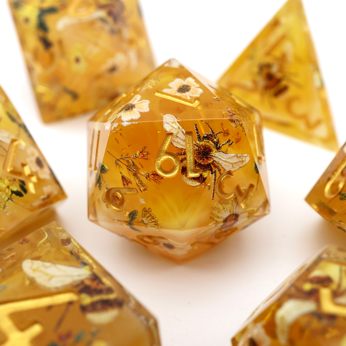 ManyM92950's tweet photo. Bottled sunshine, wildflowers, and a little honeybee magic. Sharp edges never looked so sweet. โจ๐ฏ
#dnd #resinart #handmadedice #polyhedraldice https://t.co/wiLJv9ITTD