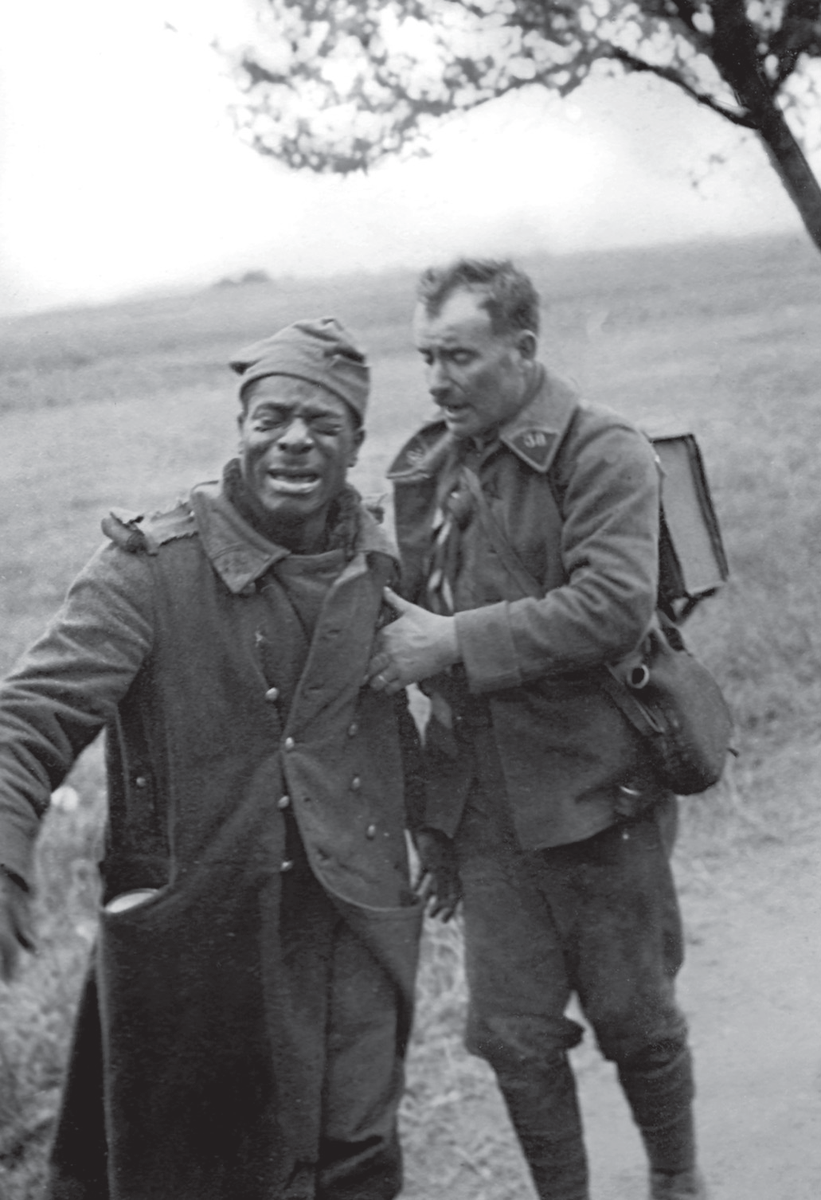 Vanguard_WW2's tweet photo. Two French soldiers after their capture by the Germans near Lille, May 1940.

The visibly distraught West African rifleman is comforted by a fellow soldier whose collar bears the number "38", identifying the 38th Infantry Regiment. 

Part of the 25th Motorized Infantry Division, the regiment fought in Belgium before being encircled around Lille, resisting until May 31. 

The African soldier probably belonged to a different colonial unit. His identity and the exact location remain unknown, but the photograph (a German soldier who took part in the campaign) captures the human reality of the French Army’s chaotic retreat.

Their names remain unknown.

Follow @Vanguard_WW2  for more