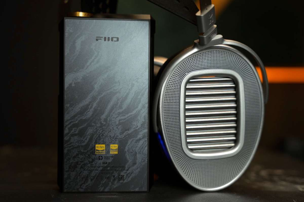 Earside_HiFi's tweet photo. @FIIO_official M27: The Hassle-Free Solution for Driving High-End Headphones 

Type: Portable Digital Audio Player 

Price: $2,199 USD 

FiiO releases new products at a rapid pace, but the company has always been careful with flagship updates. The previous flagship, the M17, arrived in 2021. It became a benchmark for what FiiO could achieve: powerful hardware, extensive features, exceptional output power, and remarkable versatility. Even today, the M17 remains one of the most complete DAPs on the market. If portable audio had a Hall of Fame, the M17 would deserve a place in it. 

As the successor to the M17, the M27 attracted significant attention long before launch. The final product has largely met expectations. Driven by strong word-of-mouth within the audiophile community, sales reached several thousand units shortly after release. More notably, many owners use flagship headphones such as Focal Utopia and MEZE ELITE - something rarely seen among M17 users. 

Back during the M17 era, FiiO introduced the idea of a “portable desktop-class amplifier.” In reality, the M17 could drive full-size headphones competently, but it still felt like a secondary feature. Four years later, the concept has matured. The improvements are not limited to specifications. The sonic foundation and headphone synergy have advanced significantly. (Note: This review is based on the aluminum version of the M27. Other editions may differ slightly.) 

Hardware: A Major Leap Forward 

FiiO openly published a full specification comparison between the M27 and M17. The changes are substantial. The M27 uses Qualcomm’s QCS6490 platform, built on the same architecture as the Snapdragon 778G, paired with 8GB RAM and 256GB storage. As streaming apps continue to grow larger and more demanding, this hardware should ensure long-term responsiveness and smooth operation. 

For audio duties, the M27 employs dual ES9039SPRO DACs. Compared to the previous generation, performance improves while power consumption is reduced. Bluetooth duties are handled by the Qualcomm QCC5181, supporting aptX Lossless for wireless lossless reception. Maximum headphone output reaches 5000mW, roughly 40% higher than the M17. 

Practical design upgrades are equally important. The M27 retains a 6.35mm single-ended output. For many imported headphones that still ship with single-ended cables, this is genuinely useful and avoids unnecessary adapters. Dual microSD card slots provide expanded storage flexibility. A standard optical output joins the RCA coaxial connection, making integration with desktop systems and speaker setups easier. External power now uses USB-C, accompanied by a dedicated desktop mode switch. These refinements noticeably improve day-to-day usability. 

The trade-offs remain obvious. The M27 is large. It is heavy. Heat output is substantial. Those compromises are inevitable when pursuing desktop-class performance in a portable form factor. 

Sound: FiiO’s New Flagship Tuning Philosophy 

The M27 represents FiiO’s latest flagship tuning philosophy. Since expanding into the desktop Hi-Fi market, FiiO’s higher-end products have adopted a more traditional Hi-End approach. This is not about adding coloration, artificial warmth, or exaggerated vocal focus. Instead, the focus is on soundstage structure, hierarchy, density, control, and tonal refinement. Products like the K9 Pro and the newer K17 already demonstrated this shift. Technical performance did not improve dramatically on paper, yet the K17 delivered noticeably better stability, stronger micro-detail retrieval, and a richer, more engaging presentation. 

The same evolution is apparent when comparing the M27 to the M17. The M17 could occasionally sound slightly hollow when driving demanding flagship headphones during complex passages. The M27 sounds far more grounded and authoritative. A simple analogy: The M17 resembles pudding. Soft, elastic, pleasant, and spacious, but somewhat loose in structure. The M27 resembles premium gelato. Dense, compact, focused, controlled. 

Soundstage size remains similar, but the M27 delivers a darker background, higher information density, stronger image focus, and significantly improved instrument placement. Details never spill forward unnaturally. Every element remains stable and clearly organized within the stage. This sense of control was previously found in desktop products such as the FiiO K19 and R9. The M27 successfully brings that level of refinement into a portable device.Its starting point is simply higher than the M17. 

Balanced, Natural, and Musical 

The M27 continues FiiO’s long-standing flagship philosophy: balanced and faithful reproduction. More importantly, it achieves neutrality without sounding sterile. 

Many listeners associate highly resolving sound with dryness or harshness. That assumption is especially common with ES9039SPRO-based devices. In reality, much of the so-called “digital sound” comes from insufficient implementation. Weak power delivery and poor signal handling often create a flat, thin presentation. When properly implemented, the ES9039SPRO is neither cold nor mechanical. The M27 demonstrates this clearly. It extracts excellent technical performance while maintaining natural timbre and emotional engagement. The midrange carries a subtle touch of warmth that gives vocals a convincing sense of life. 

For example, take Libiamo ne’ lieti calici (Brindisi) from Verdi’s La Traviata, performed by Luciano Pavarotti and Dame Joan Sutherland. Pavarotti’s lower register is rich and resonant. His upper range remains open and metallic without becoming aggressive. Sutherland’s soprano is smooth and airy. Together, they create a compelling contrast. As the orchestra and choir build, string textures become increasingly apparent. The atmosphere expands naturally. Dynamic swings are reproduced with confidence and control. Small inflections remain intact. Large-scale crescendos never feel strained.

The Real Advantage: Headphone Driving Power 

The M27 is not designed to impress with exaggerated first-listen effects. Its strength lies elsewhere: consistency, control, power. Among portable devices of similar size, it is one of the very few that can genuinely drive high-end full-size headphones well. Many portable products advertise large power numbers. Some excel in specific areas but struggle elsewhere. Common issues include muddy bass, compressed dynamics, and limited separation.The M27 avoids these pitfalls. The sonic foundation remains stable. Power reserves are abundant. Control is maintained.

With standard operation, Medium Gain is sufficient for headphones like the FT7 and MEZE 109 PRO. The presentation remains spacious, fast, and clean. For more demanding models such as the Sennheiser HD 800 S, MEZE ELITE, and HIFIMAN HE1000 Unveiled, connecting external power and activating Super High Power Headphone Mode unlocks the M27’s full capability. Many hybrid desktop-portable devices simply increase volume and soundstage when switching into desktop mode. Excitement rises, but control suffers. The M27 takes a different approach. It preserves headroom. It maintains composure. Dynamics remain balanced. Energy is delivered without excess. The result is impressive versatility. Solo recordings sound delicate and nuanced. Large orchestral works retain scale and authority. The HD 800 S gains low-frequency presence often missing from portable setups. The MEZE ELITE benefits from improved resolution and stage expansion. While dedicated desktop systems can still extract the final percentage of performance, the M27 already surpasses many desktop amplifiers in overall execution. 

The few desktop systems that clearly outperform it are typically much larger and significantly more expensive. 

Equally Impressive with Flagship IEMs 

The M27 is not only a headphone powerhouse. It also performs exceptionally well with flagship IEMs. 

Take the Noble VKRP for example. Many portable devices struggle to fully open its soundstage and separation. Desktop gear is often required to unlock its full potential. The M27 handles it remarkably well. Lateral expansion is convincing. Layering is excellent. Instrument positioning approaches flagship headphone territory. Treble remains controlled without becoming aggressive. Other high-performance models such as the Sennheiser IE 900 and Astell&Kern LUNA also benefit from the M27’s neutral foundation. Their individual tuning characteristics remain intact while technical performance is fully realized. Whether used as a reference source for reviews and exhibitions or as a universal solution for owners of multiple headphones and IEMs, the M27 stands out as one of the strongest options around $2,000. 

Conclusion 

The market has changed dramatically since the M17 launched in 2021. Today, $2,000–$4,000 flagship DAPs and IEMs are commonplace. Against that backdrop, the M27’s pricing feels surprisingly restrained. The M17 was already an outstanding product. The M27 improves upon it in nearly every meaningful area. 

Its understated marketing and engineering-focused image may cause some listeners to overlook it when discussing top-tier flagship DAPs. Objectively, the M27 competes comfortably with flagship players priced below $4,000. When it comes to driving full-size headphones, very few portable devices in its class can match it. 

More importantly, it finally delivers on the promise FiiO first introduced years ago: a true portable desktop-class audio system.