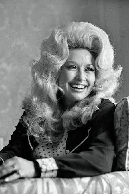 askaguruapp's tweet photo. Last week we lost an icon. Dolly Parton was one of the true artists who combined raw, real and incredible talent with authenticity. Her music channeled and championed the stories of humble yet colorful everyday people in such an extraordinary way. "Coat of Many Colors" is a favorite by her. In it she describes how love can transcend the challenges of life, and how being unable to afford fancy clothes was overcome by her mother stitching together what they had with love - a garment she wore proudly even if others laughed. 

Dolly had countless hits including "I Will Always Love You" which was covered by the incredible Whitney Houston. Whitney's unforgettable rendition would not have been possible without Dolly's genius. A testament to the fact that great art takes a life of its own and unfurls its beauty continuously.

We encourage EVERY real artist to study the life of Dolly Parton. Nashville has never been an easy place to make it, let alone at the time when Dolly was working her way up. She had to overcome many obstacles, sharks and difficult situations but she overcame them all with her unique Tennessee
toughness and smarts like a gleaming rose in a desert oasis. The Great artist lives forever through their art. Dolly was truly a GREAT artist whose music will stand the test of time.