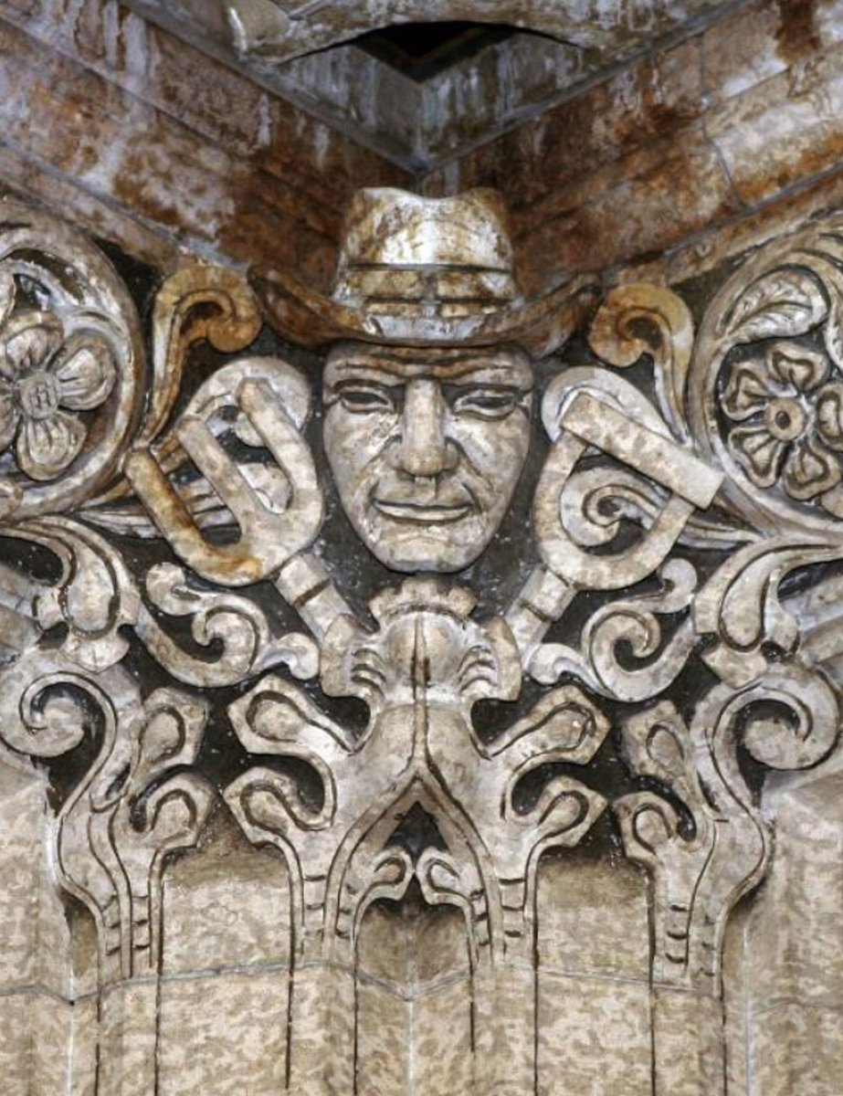 A stone carving of a farmer.