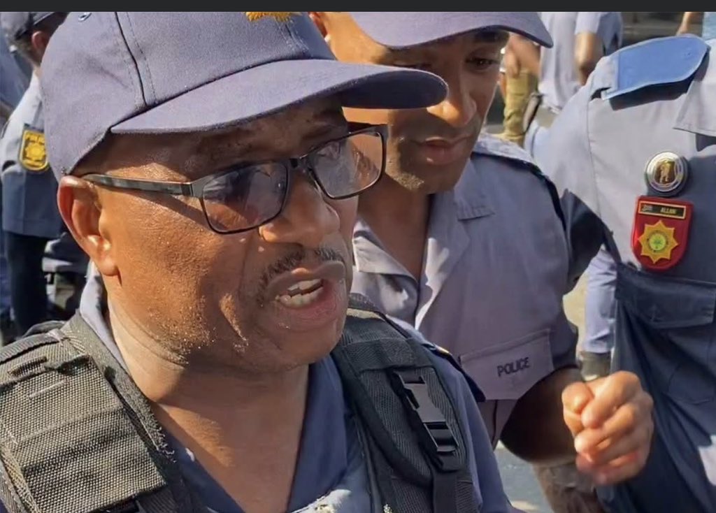 JacintaNgobese's tweet photo. This is Mpanza a police officer who decided to start shooting at people and said they are blocking the streets! He was swearing at women calling them “izf***” and he further ran to the police station to open a case against March and March after injuring 10 people, our members that he had shot tried to open a case against him and the police at Mbilo Police Station refused to open a case saying he has opened a case first😳 The strange thing is the people who started the fight are in the holding cells right now for being violent but he claims it was March and March? My question is if it was March and March then why didn’t they arrest them since they were there?? SA First Forum will take this matter on in court, ngeke sidlale Amaphoyisa, using and abusing the law