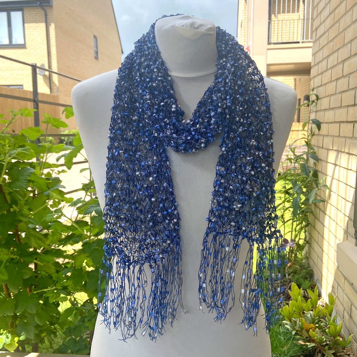 KentCrafts's tweet photo. This handmade ladder yarn scarf neck warmer is hand-knitted with blue and silver trellis ribbon yarn and comes with a silver buckle slider. Price includes Tracked 24 UK postage. Available in my Etsy shop at: https://t.co/7xd23OfK7B #etsyhandmade #etsyseller #etsygifts #bluescarf https://t.co/lE57dQWxUT