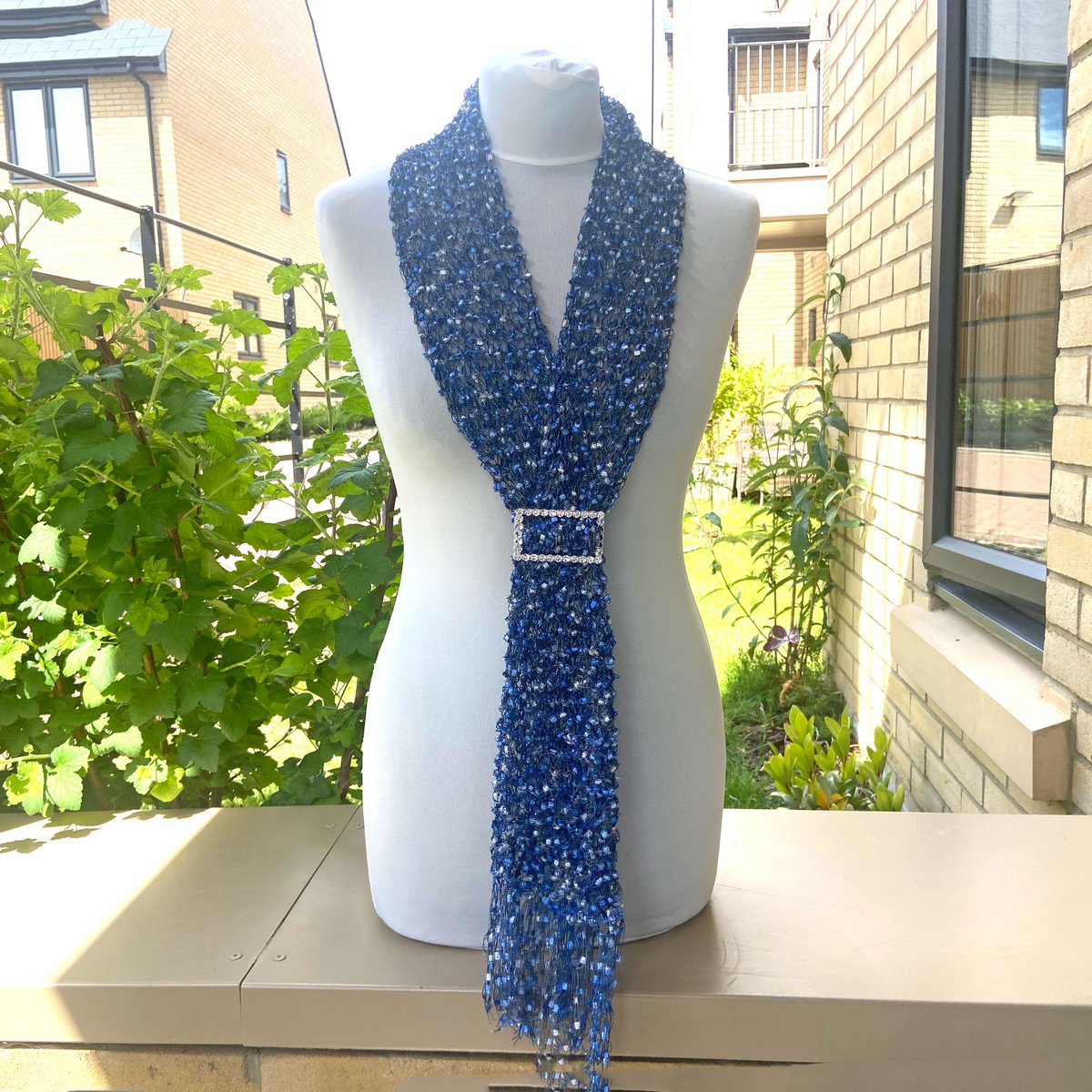 KentCrafts's tweet photo. This handmade ladder yarn scarf neck warmer is hand-knitted with blue and silver trellis ribbon yarn and comes with a silver buckle slider. Price includes Tracked 24 UK postage. Available in my Etsy shop at: https://t.co/7xd23OfK7B #etsyhandmade #etsyseller #etsygifts #bluescarf https://t.co/lE57dQWxUT