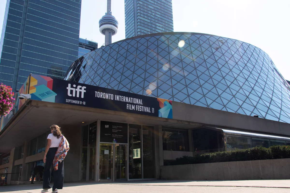 View of the Toronto Film Festival signage with the CN Tower in the background.
