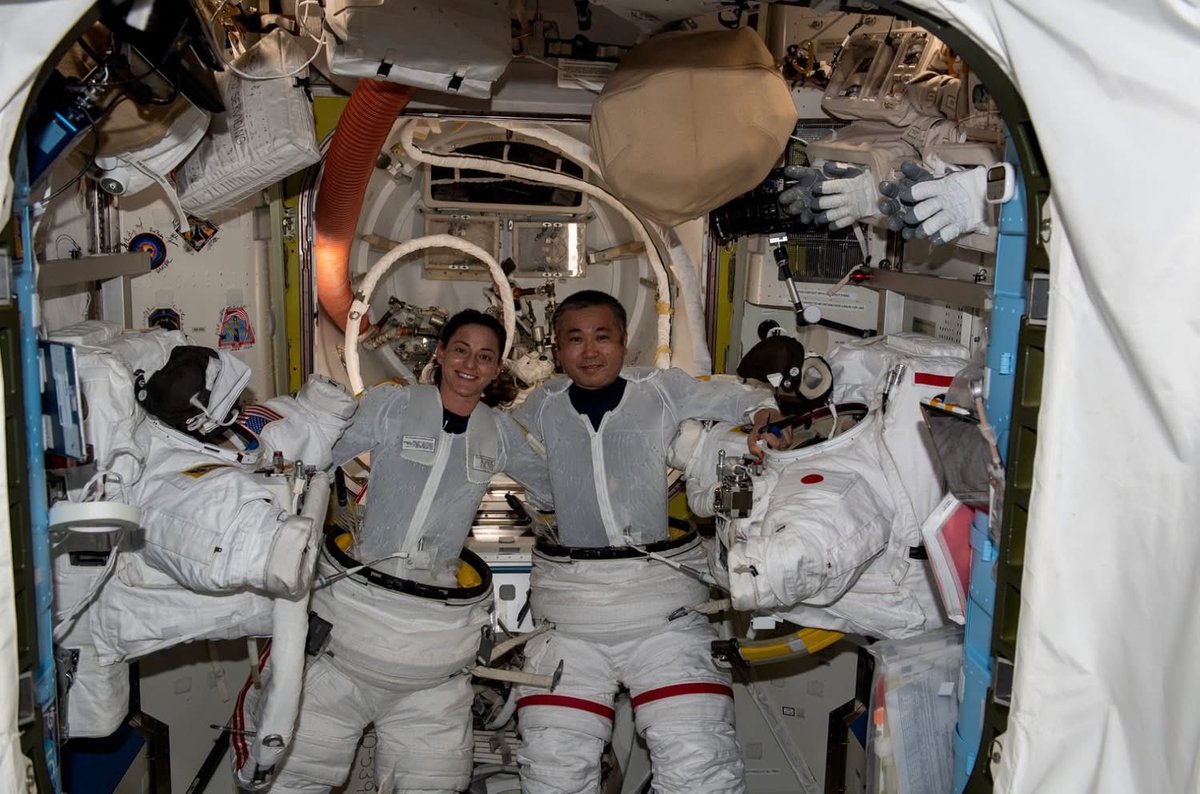 Astro_Wakata's tweet photo. NASA's EMU (spacesuit) has supported hundreds of successful spacewalks on the Shuttle and International Space Station. Its waist-entry design was deliberately chosen for modularity, allowing different sizes of components to fit a wide range of crew members, while keeping the system relatively lightweight and reliable for microgravity operations. That choice has served us well for decades. For the lunar surface, however, the requirements are different. Walking, kneeling, and conducting science on the lunar surface calls for improved shoulder mobility and reduced physical strain on the crew. The rear-entry design of the new AxEMU places the shoulder bearings in a more natural position, eases donning and doffing, and supports future concepts. These thoughtful evolutions will enable safer and more effective exploration. I am grateful for the engineers and teams advancing this capability, and I look forward to the day when the suits take their first steps on the lunar surface.