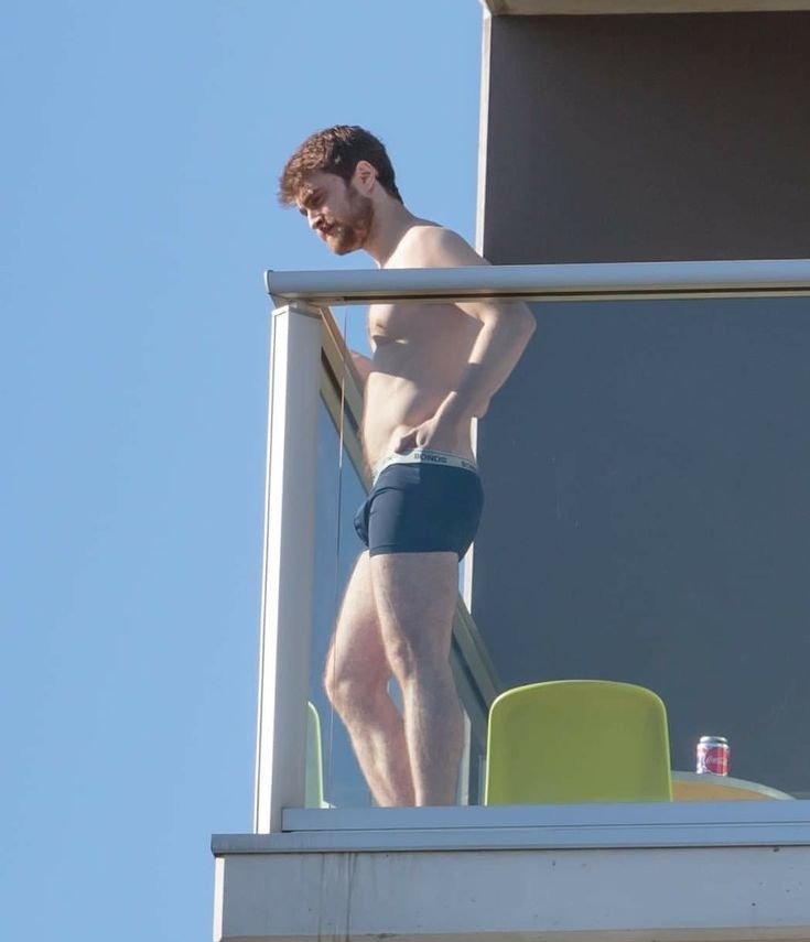 Francoballer1's tweet photo. Daniel Radcliffe goes shirtless in his underwear, enjoying a cigarette on a hotel balcony. https://t.co/lXXm2uLqbw