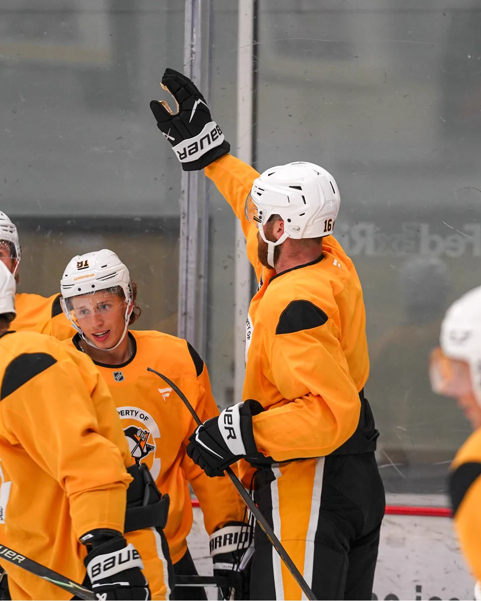 Justin Brazeau at practice, initiating a high five.