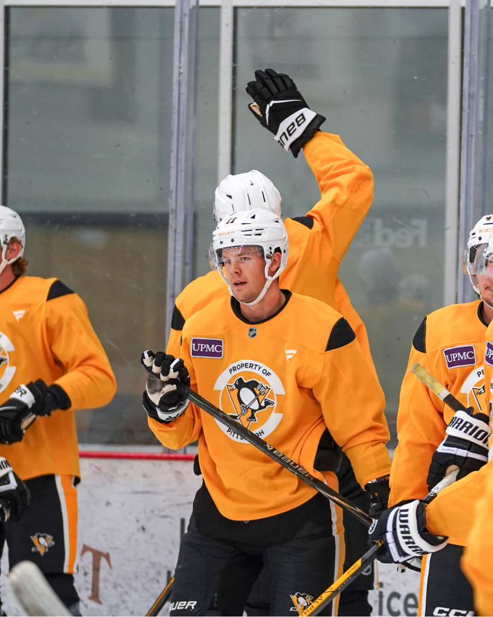 Justin Brazeau at practice, initiating a high five.