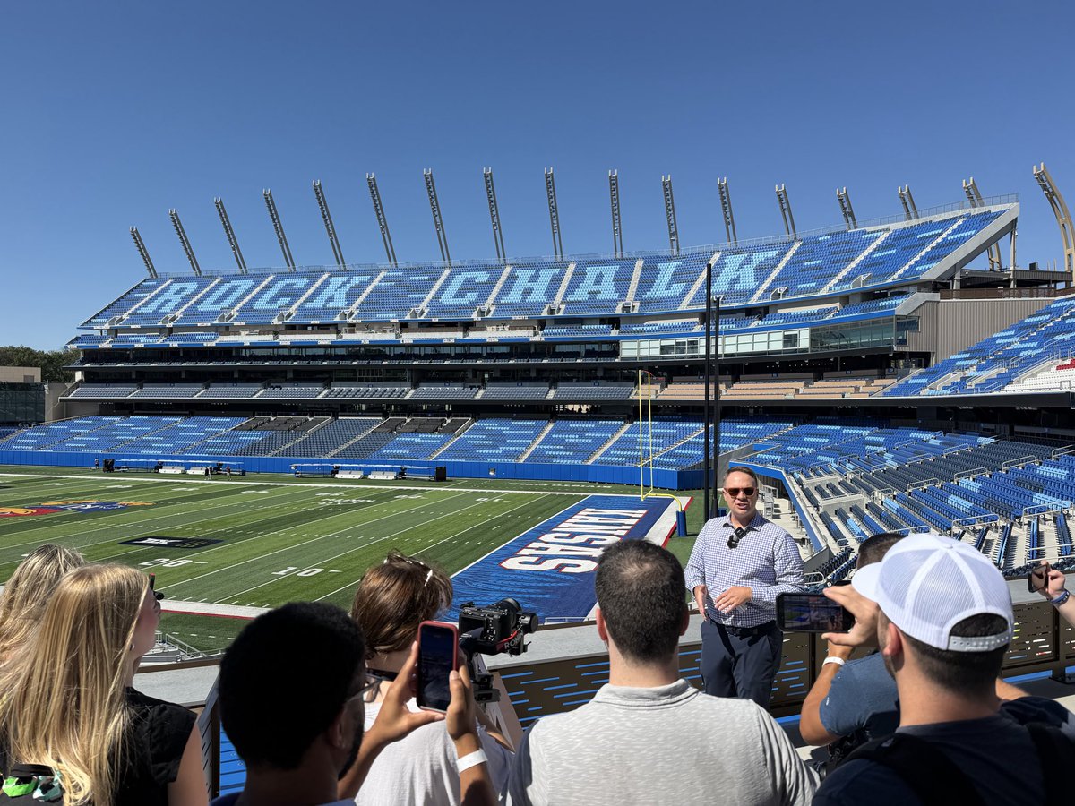 BHanni's tweet photo. So proud to see Phase 2 of the Gateway District rounding into form. As Travis announced today, the East side lower bowl and South grandstands offer 8,400 seats getting this year’s capacity to 32,000 and eventually a number closer to 43,000, with targeted completion prior to the 2027 season.

The progress over the last 9 months has been tremendous & the plans that follow in Phase 3 with all the additional fan amenities & experiences they’ll offer have KU fans on the cusp of something truly special. As a lifelong Jayhawk, I can’t help but be filled with immense pride. Just goes to show you what can be accomplished when visionary leadership & alignment team up with unprecedented generosity & support.

Get excited, Jayhawk fans. Something far greater than most could have dreamed is now coming to fruition. Let’s get out and support this team this Fall and prepare to enjoy a stadium & district we can be proud of for generations to come! Rock Chalk!