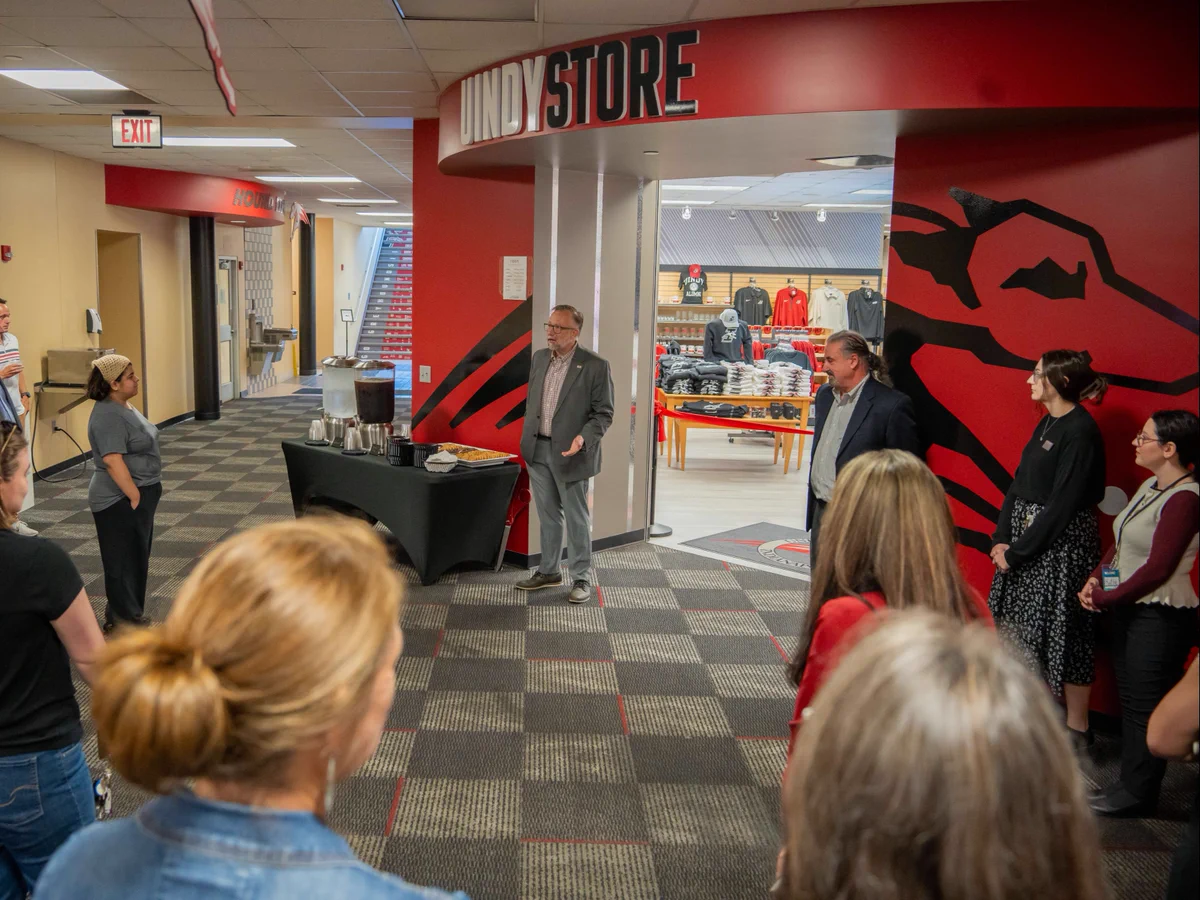 UIndy CFO Corey Back delivers remarks at the ribbon cutting for the newly renovated UIndy Bookstore.