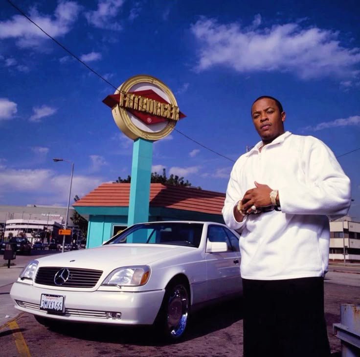 bigharris1212's tweet photo. Dr. Dre outside Fatburger with the white Mercedes S-Class coupe, shot by Mike Miller in 1996. Peak West Coast royalty. https://t.co/MVqCdjbPRc