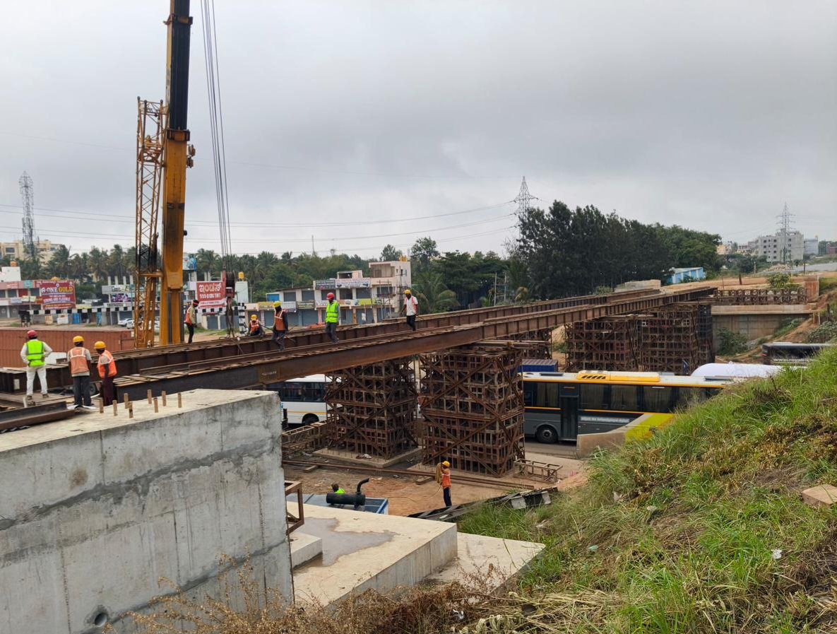 KridePrm's tweet photo. Temporary Beam Launching Completed for Major Bridge (RUB) No. 470 across NH-44

Bengaluru, 04 September 2026:
The Baiyappanahalli–Hosur (BYPL–HSRA) 48 km Doubling Track Project achieved a significant milestone with the successful launching of Temporary ISMB 600 beams for Major Bridge (RUB) No. 470 across NH-44 (Hosur Highway), near Chandapura.

The launching activity was carried out under a road traffic block during night hours, in coordination with the Traffic Police. It was  commenced on 03 September 2026 and was successfully completed on 04 September 2026, with all necessary safety measures implemented throughout the activity.

The proposed 61.00 m wide Open Web Girder (OWG) bridge will eliminate the existing bottleneck at the railway crossing by providing a wider and safer passage for road traffic, thereby reducing congestion, improving traffic flow and enhancing road safety.

The successful launching marks another important milestone in the ongoing BYPL–HSRA(48km) Doubling Track Project.

#KRIDE #BSTP #InfrastructureDevelopment #RailwayInfrastructure #BridgeLaunching #BridgeConstruction #ProjectProgress #ConstructionUpdate #TrafficManagement #RoadSafety #NightWork #EngineeringExcellence #UrbanInfrastructure #Bengaluru #BengaluruInfrastructure #SafeConstruction #ProjectMilestone