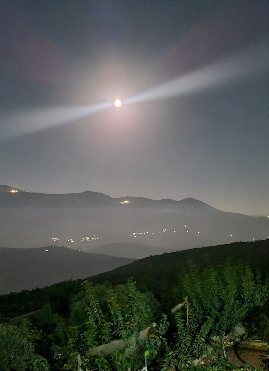 Marwa__Osman's tweet photo. 3 years ago today, I was sitting on my balcony in my home in Khiam, south Lebanon, watching and capturing the full moon on a serene calm beautiful night. Today, Khiam is occupied, calm nights in south Lebanon are a myth and my home...well I have no idea what happened to my home.
I know one thing for sure though, my hatred, animosity and disgust towards terrorist Israel is as massive as entire planets and my support for active armed resistance against this cancerous entity has never been more firm.

I promise myself and my kids...we will return to our hometown, whether our house remains or not..the land is forever ours.