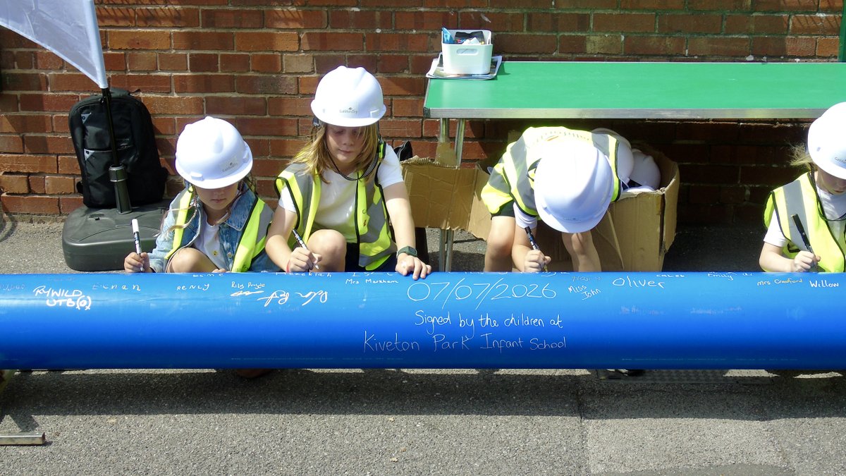 Children at Kiveton school signing the pipe