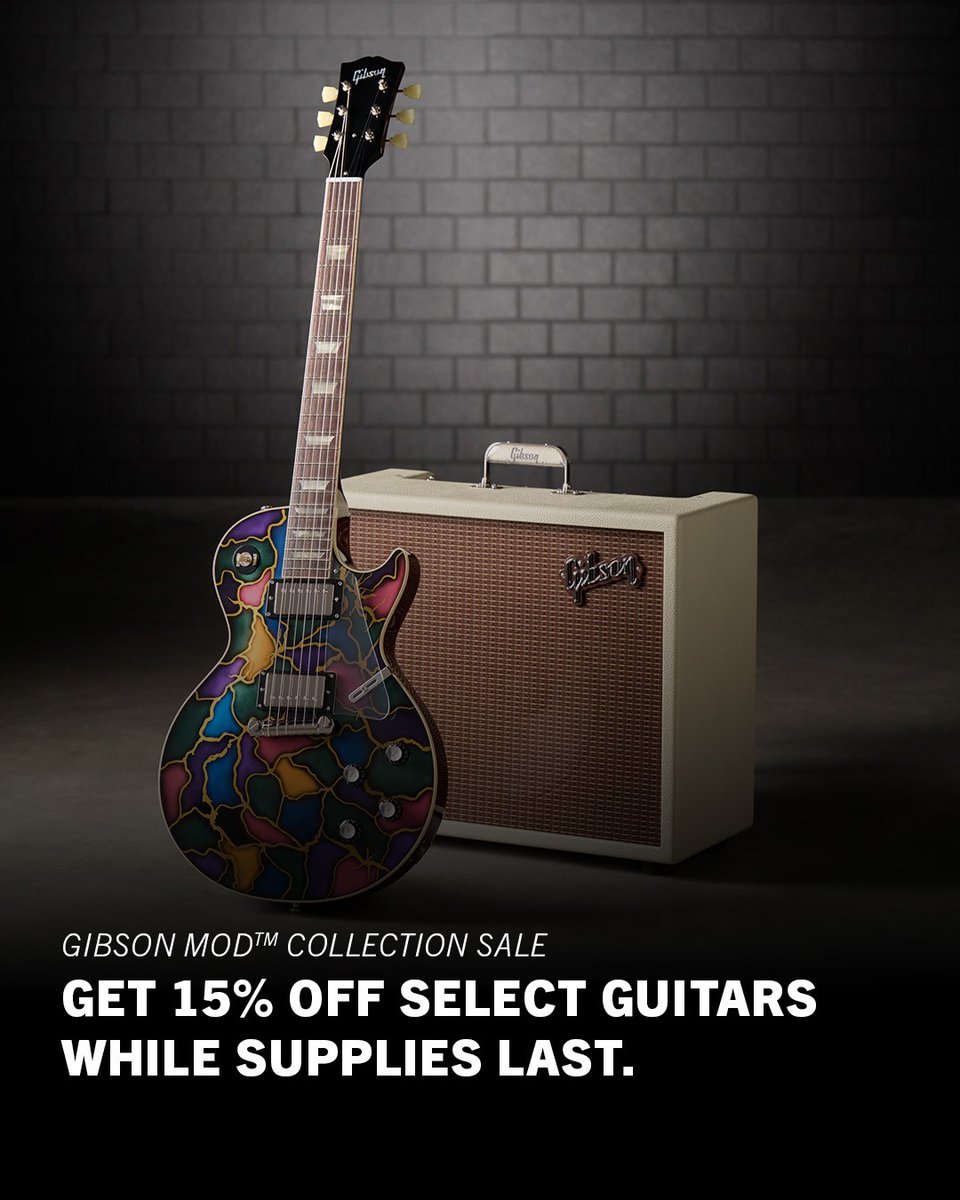 Image of a Gibson Mod Collection guitar with a colorful abstract pattern, propped next to a Gibson amplifier against a brick wall. Text reads "Gibson Mod Collection Sale. Get 15% off select guitars while supplies last.