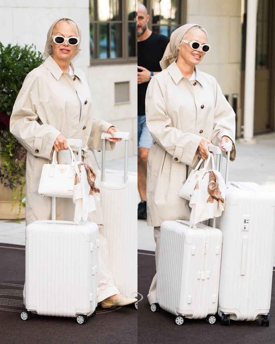 PageSix's tweet photo. Pamela Anderson’s incredibly chic trench has us ready for fall. 🤍 The icon stepped out in NYC in a monochrome look, complete with a matching set of Prada luggage. 

📸: BACKGRID https://t.co/OEqtlZFvGx