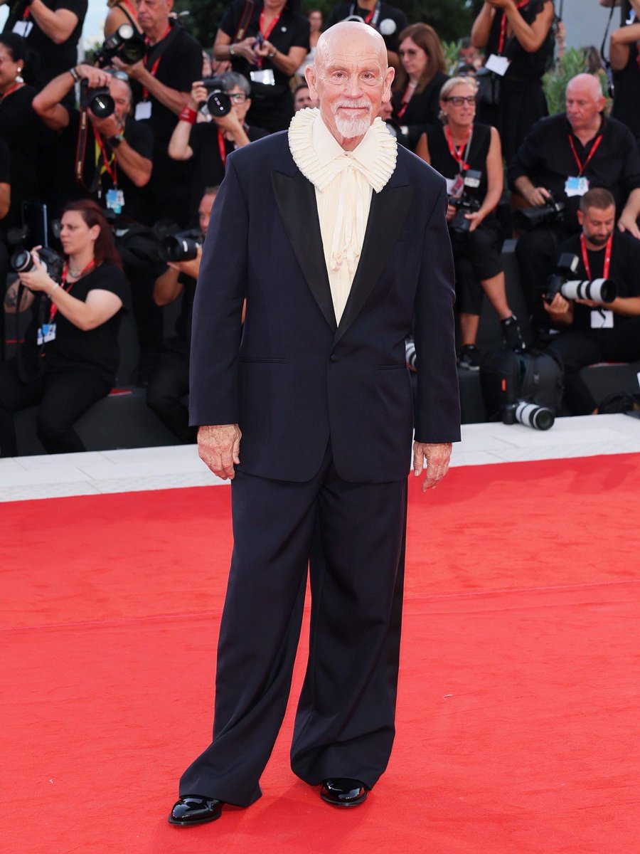luresmagazine's tweet photo. Only day two of the #VeniceFilmFestival and we might already have the best fit. John Malkovich stepped out for the "Wild Horse Nine" screening wearing a fresh-off-the-runway Dior Fall 2026 shirt with a striking ruffled collar. Masterclass tailoring! 

#Lures #JohnMalkovich https://t.co/k5nWROChIK